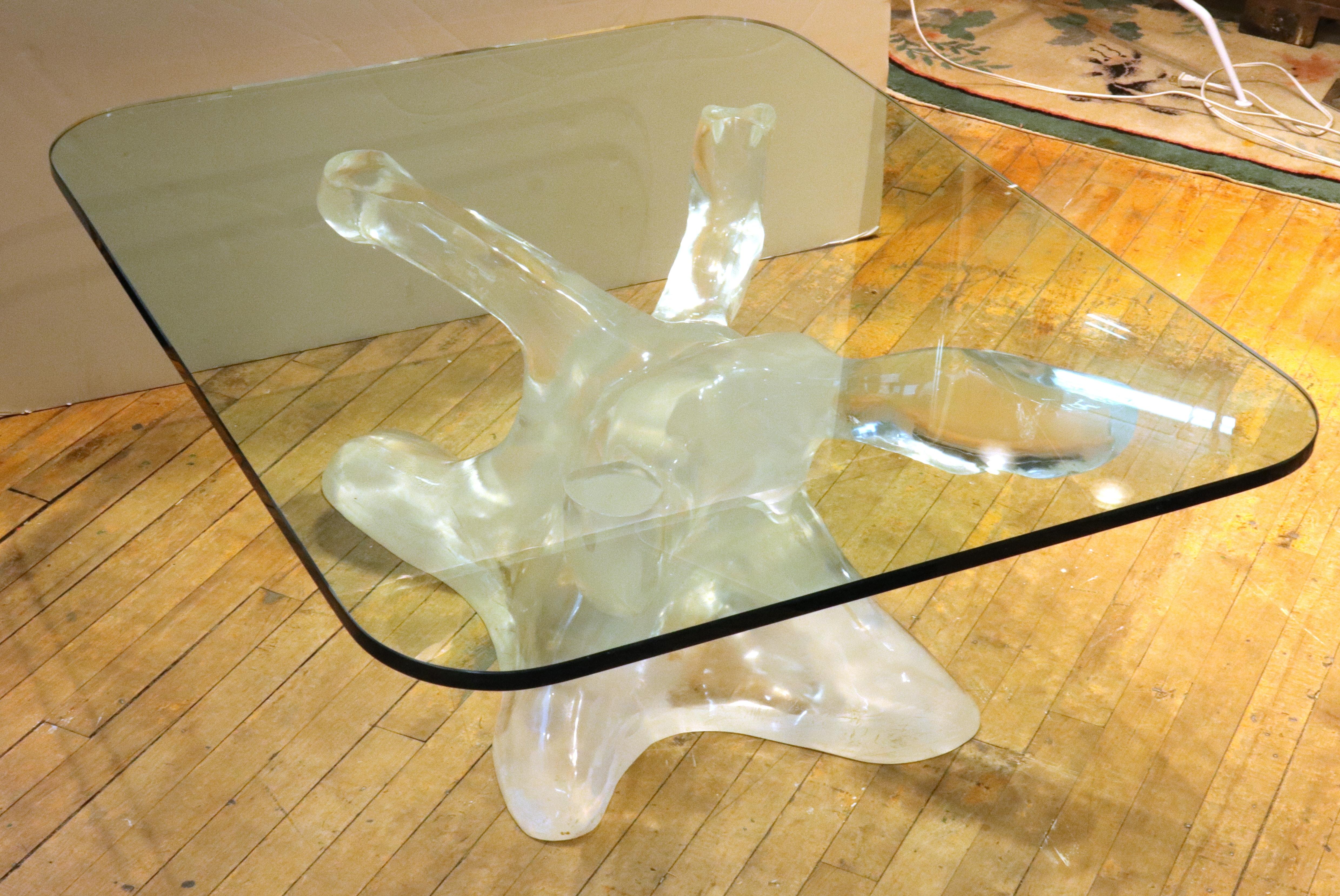 Italian modern coffee or cocktail table designed by Alberto Rocchi in the late 1970s-early 1980s. The piece has a biomorphic acrylic base in the shape of an organic tree trunk and a heavy glass top. Signed in the acrylic base with an edition number