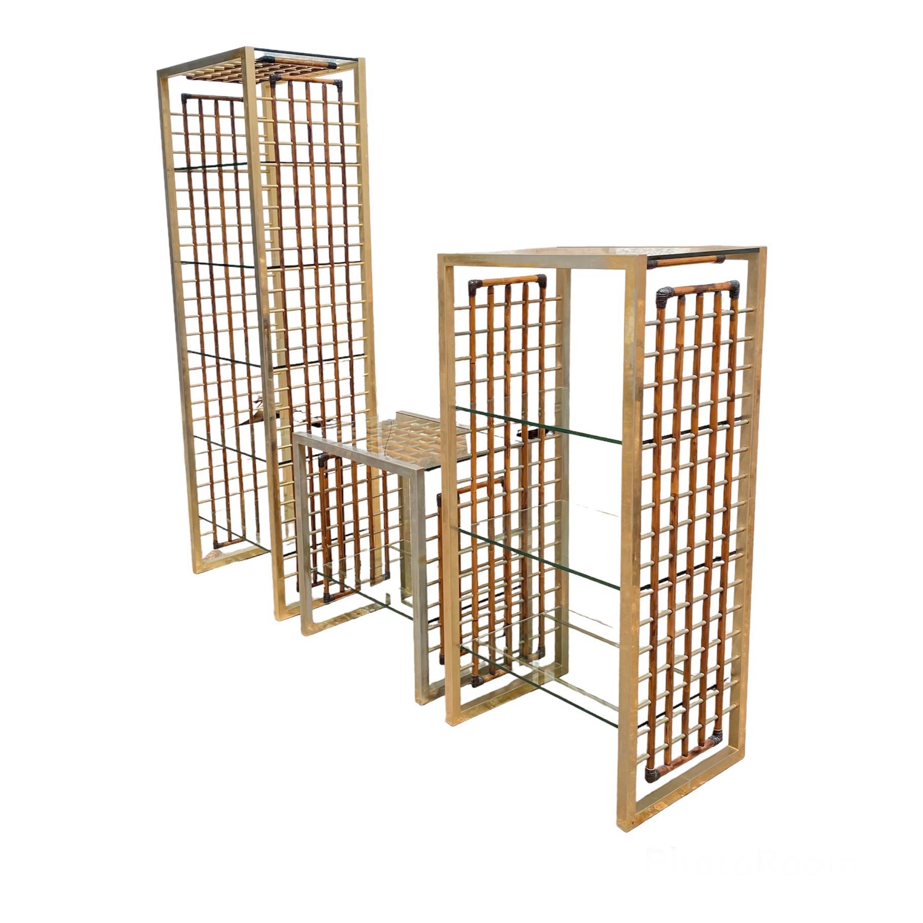 Stunning set of 3 bookcase or glass cabinet modules designed by Alberto Smania and produced by the homonymous company in Italy in 1967.
The peculiarity of these objects is they are made with noble materials such as brass, leather in the corners and