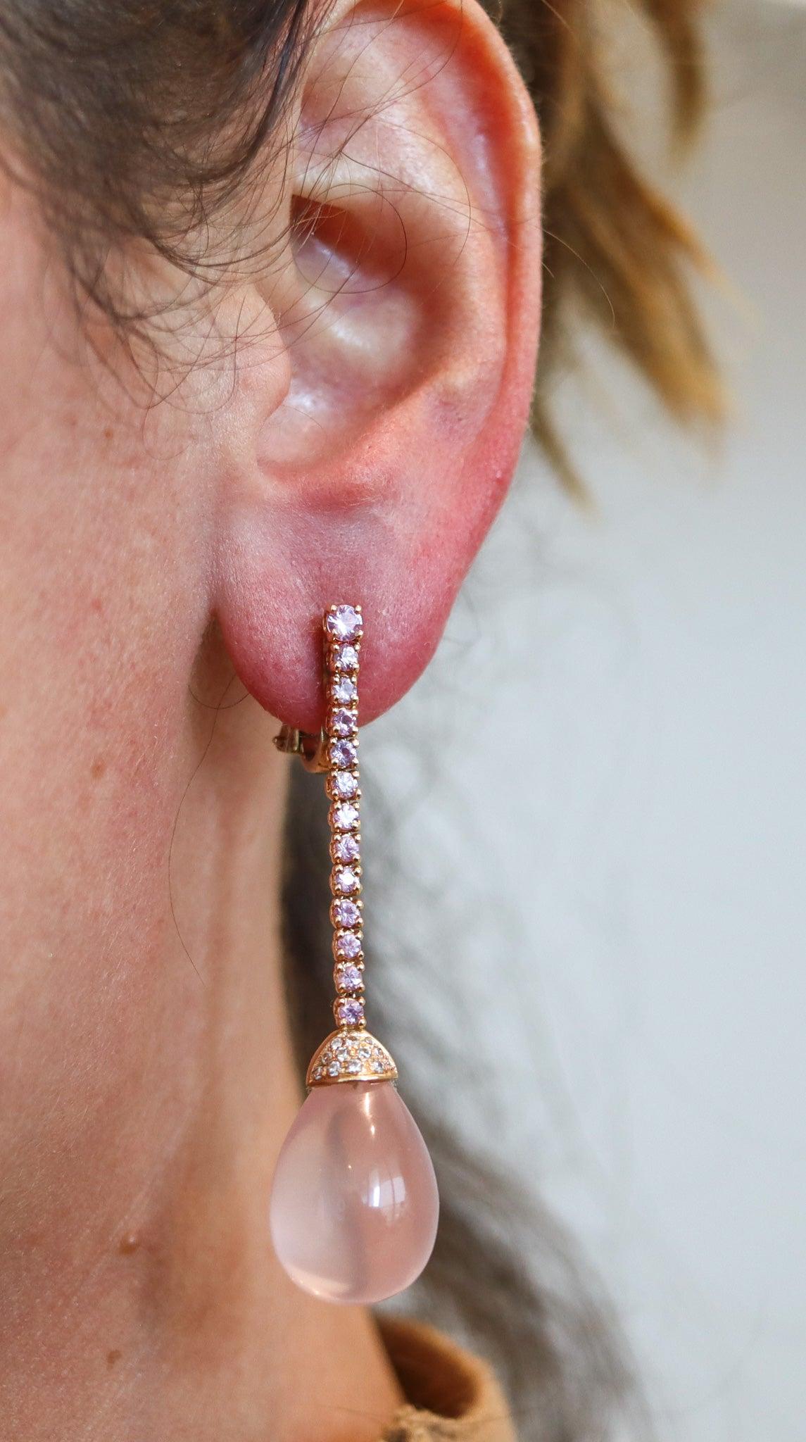 Dangle drops earrings designed by Alberto Vaccari.

This is a beautiful and colorful pair of dangle drops earrings, created in Italy by the jewelry designer Alberto Vaccari. The contemporary earrings have been crafted in solid yellow gold of 18