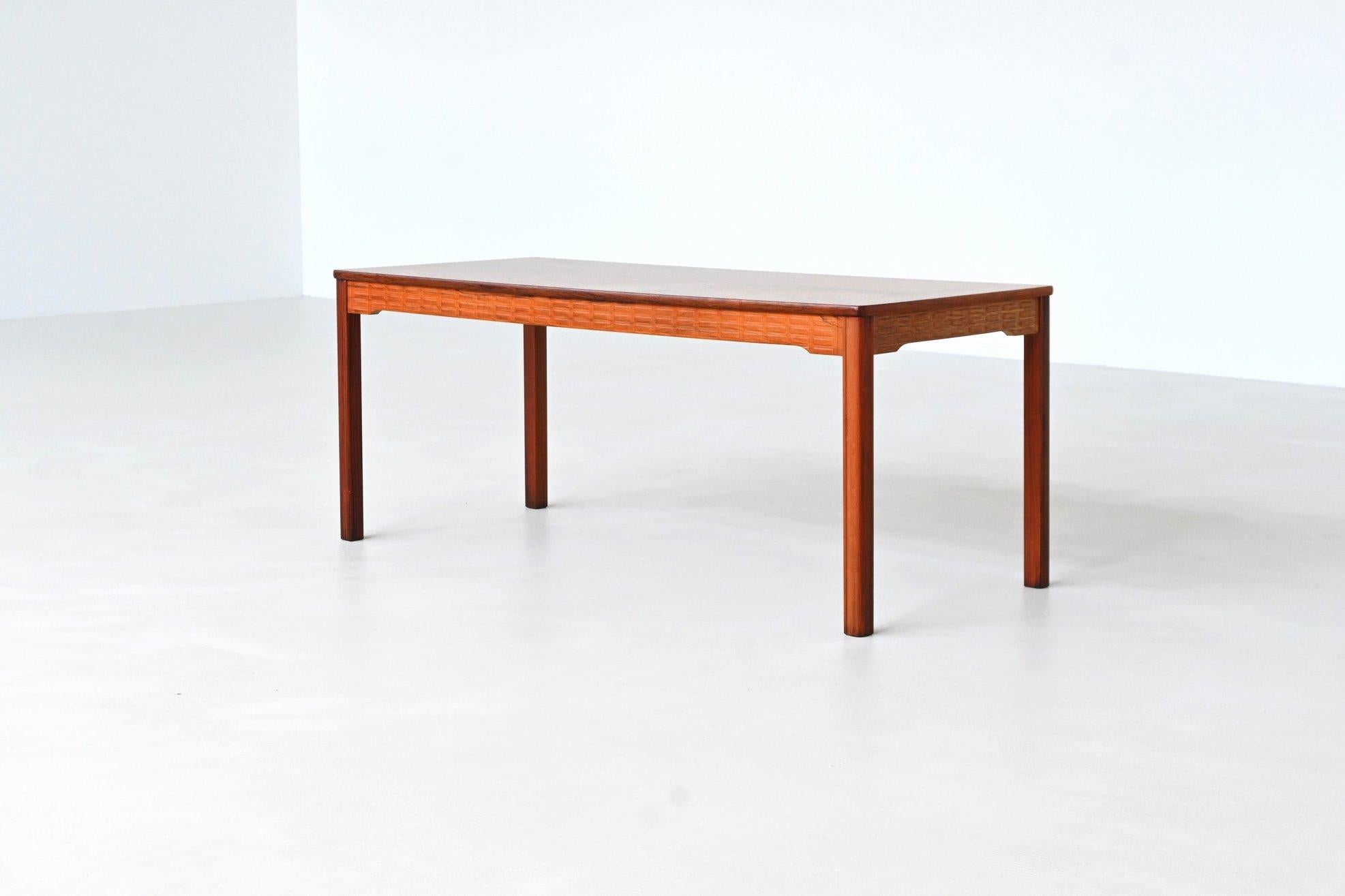Beautiful coffee table designed by Alberts Tibro, Sweden 1970. This eye-catching piece is constructed from richly grained rosewood and displays excellent craftsmanship. The rectangular tabletop features a stunning bookmatched grain pattern framed