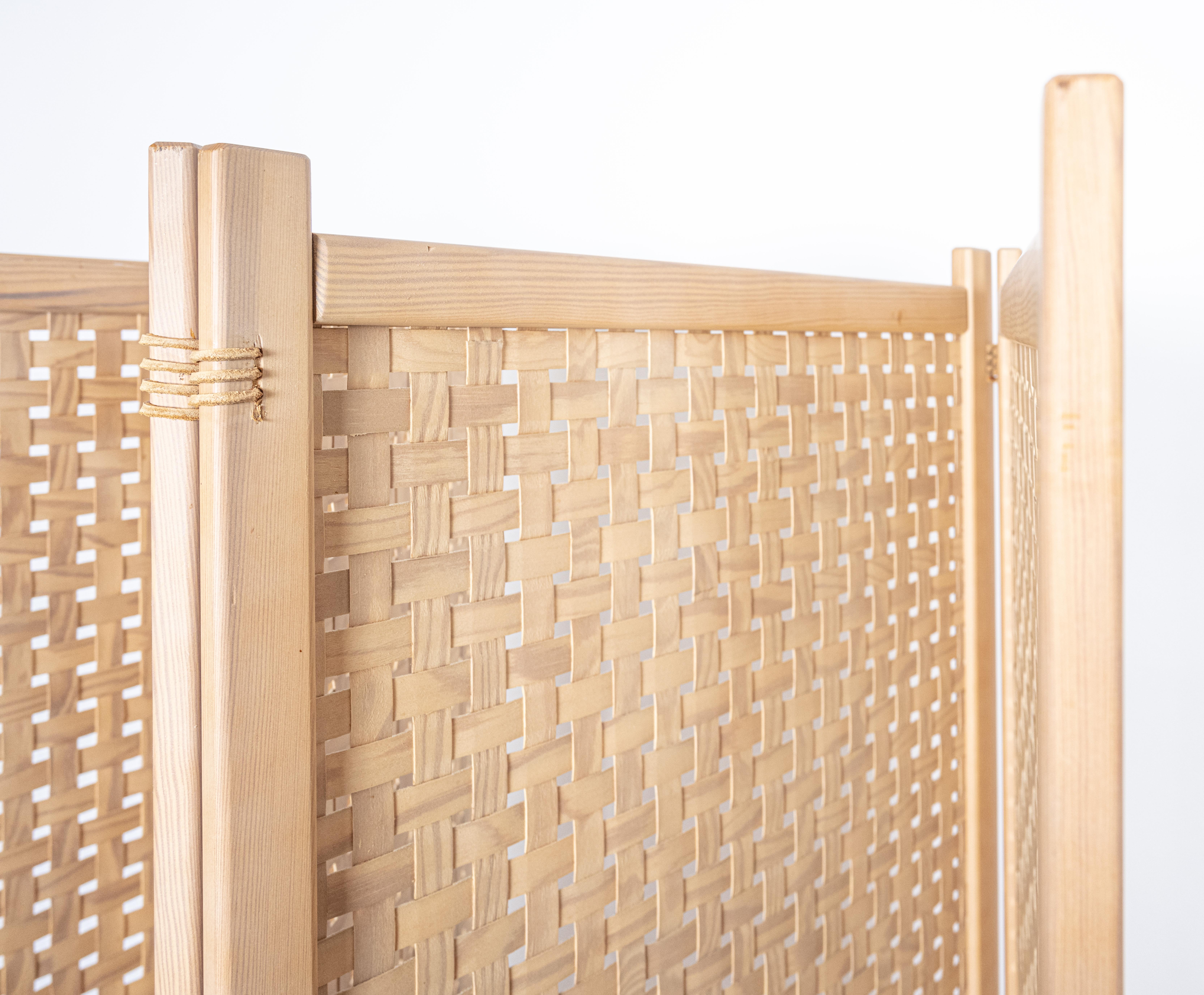 Rustic in material, refined in craftsmanship, a 4 panel room divider screen from Alberts in Tibro SE. An airy weave from strips of beech make up the panels and split hide straps bind the panels to each other. Each panel measures 23-1/2in x 62-1/4in.