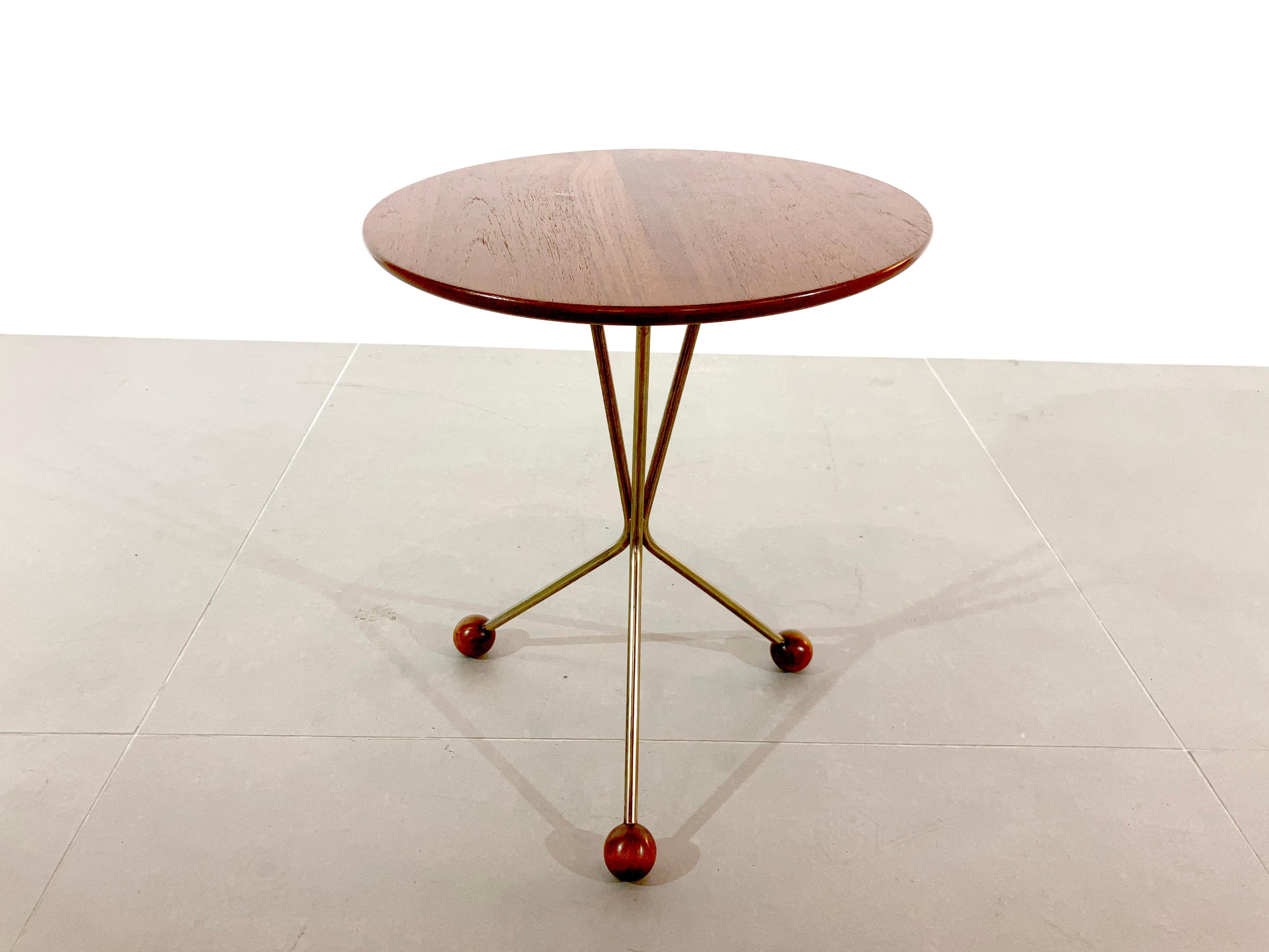A charming Little three legged circular teak wood topped occasional table, 
the top is sat on a chrome base featuring ball feet. 
This rare little side table is model 'Bord pa Burk' by Alberts in Tibro Sweden, 1950s. 

