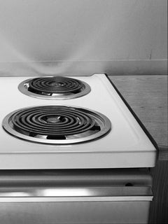Heel on Stovetop, Budget Suites, Las Vegas – Albert Watson, BW, Kitchen, Heels