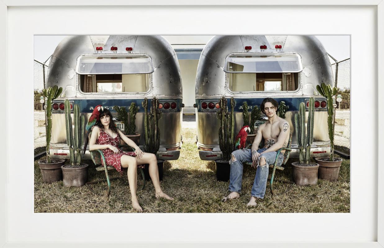 Laetitia Casta and a male model for the Pirelli calendar, sitting in camping chairs at a caravan park, photographed by Albert Watson. 

All prints are limited edition. Available in multiple sizes. High-end framing on request.

All prints are done