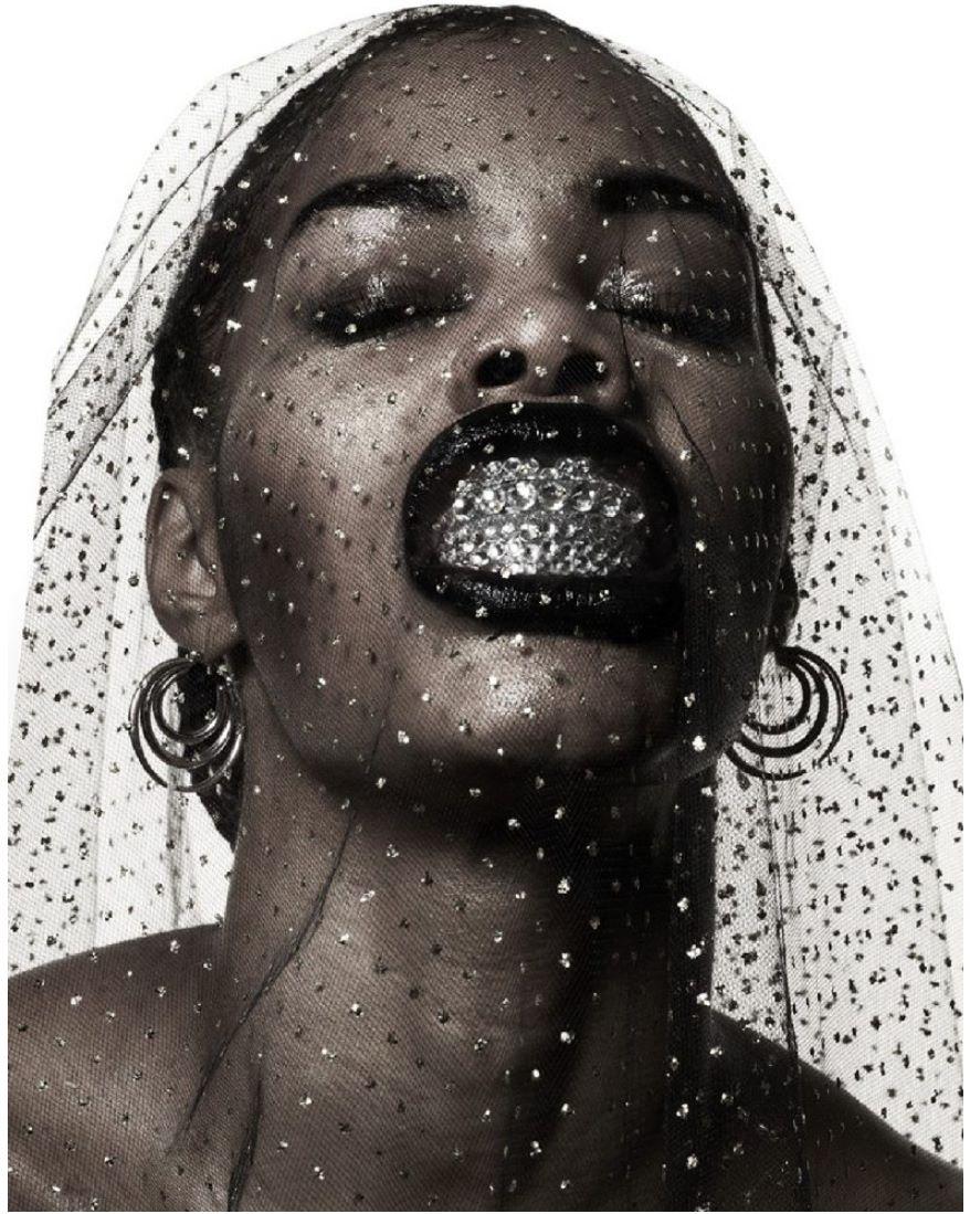 Teyana Taylor- the singers face showing her teeth with grills in a gothic style
