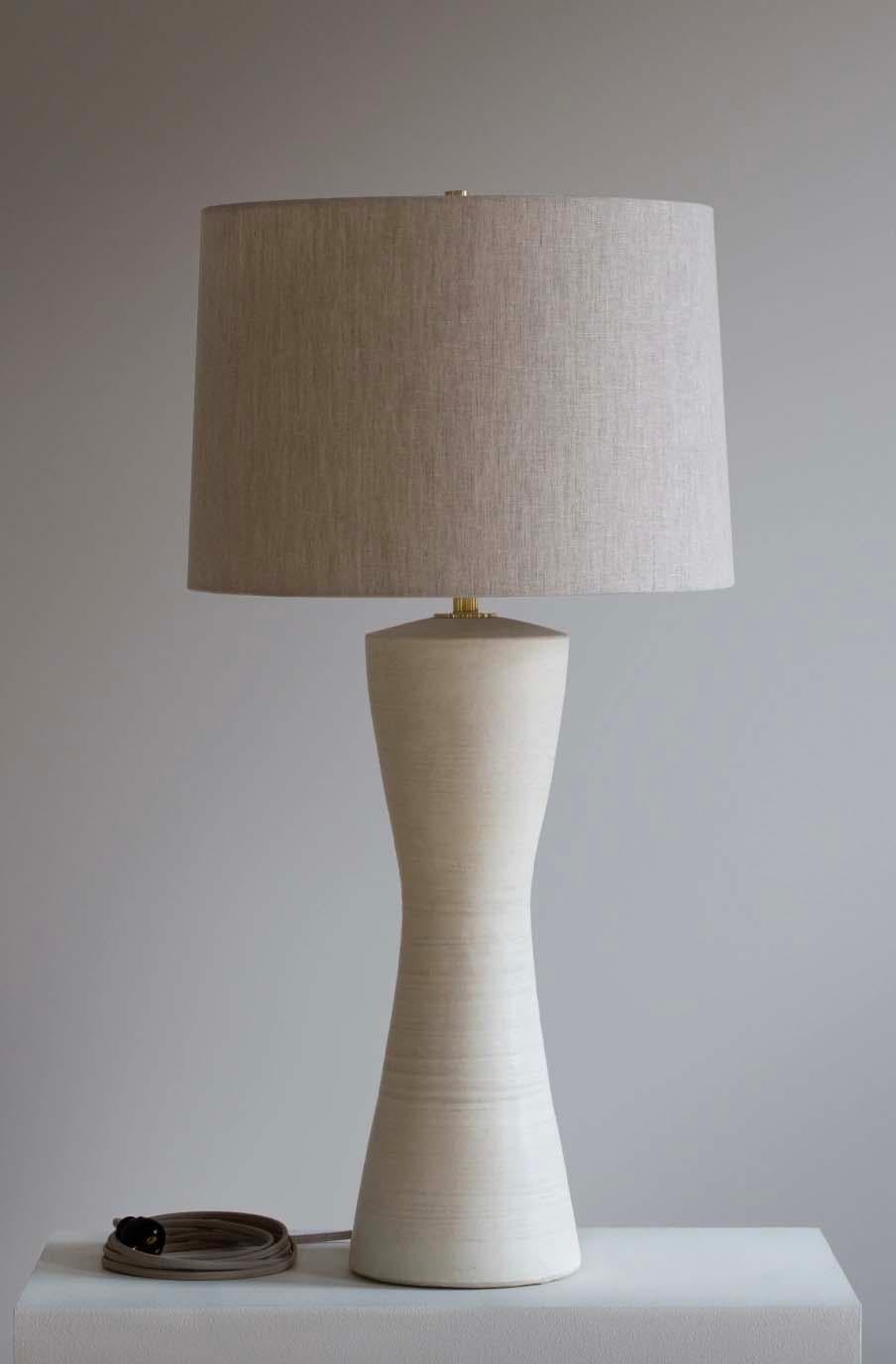 The Albia lamp is handmade studio pottery by ceramic artist by Danny Kaplan. Shade included. Please note dimensions may vary up to an inch.

Born in New York City and raised in Aix-en-Provence, France, Danny Kaplan’s passion for ceramics was shaped