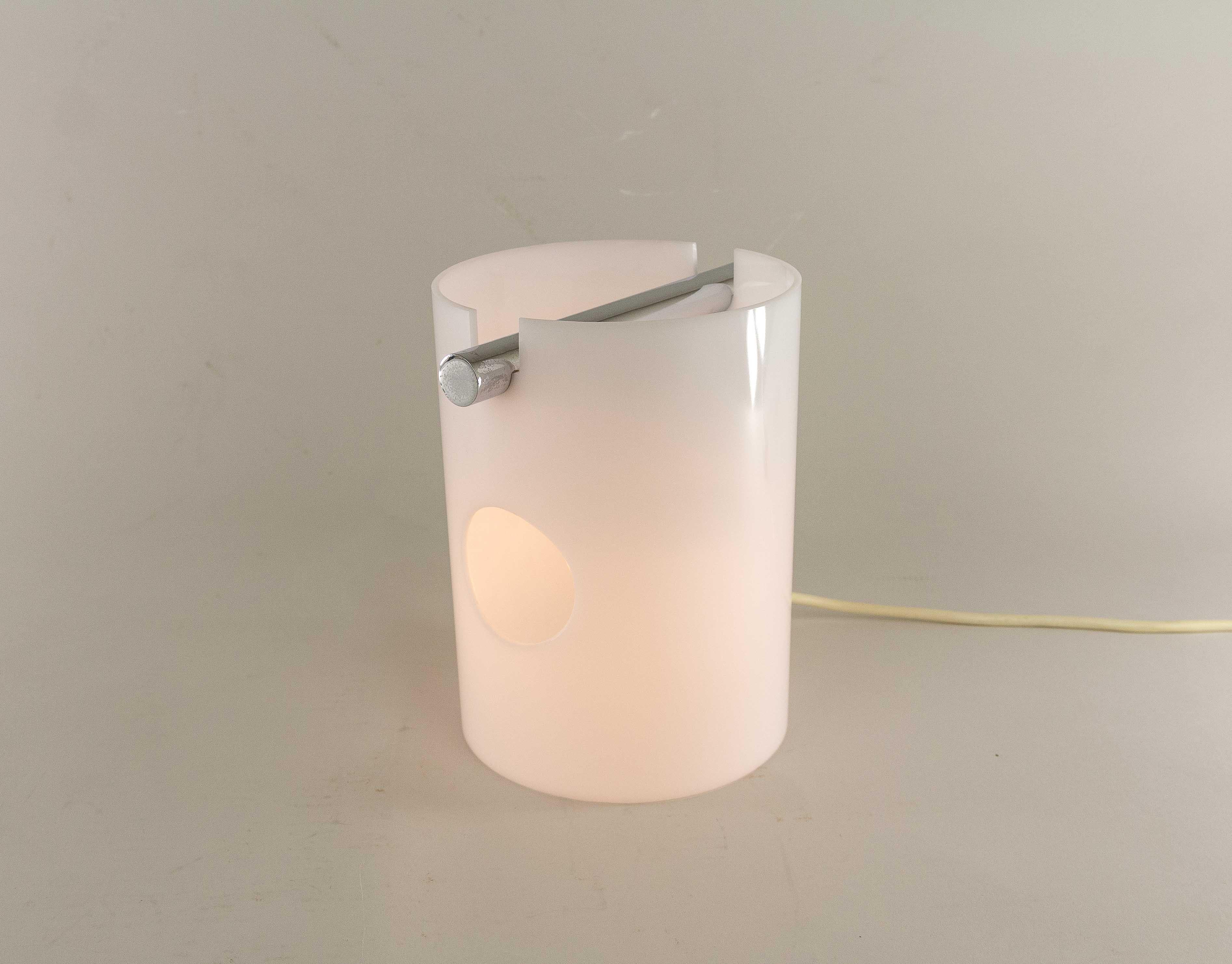 Rare Albina table lamp by Giuliana Gramigna for Italian manufacturer Quattrifolio.

Minimalist lamp with a lamp holder that is incorporated into the design in a subtle and ingenious way. This model was released simultaneously with the considerably