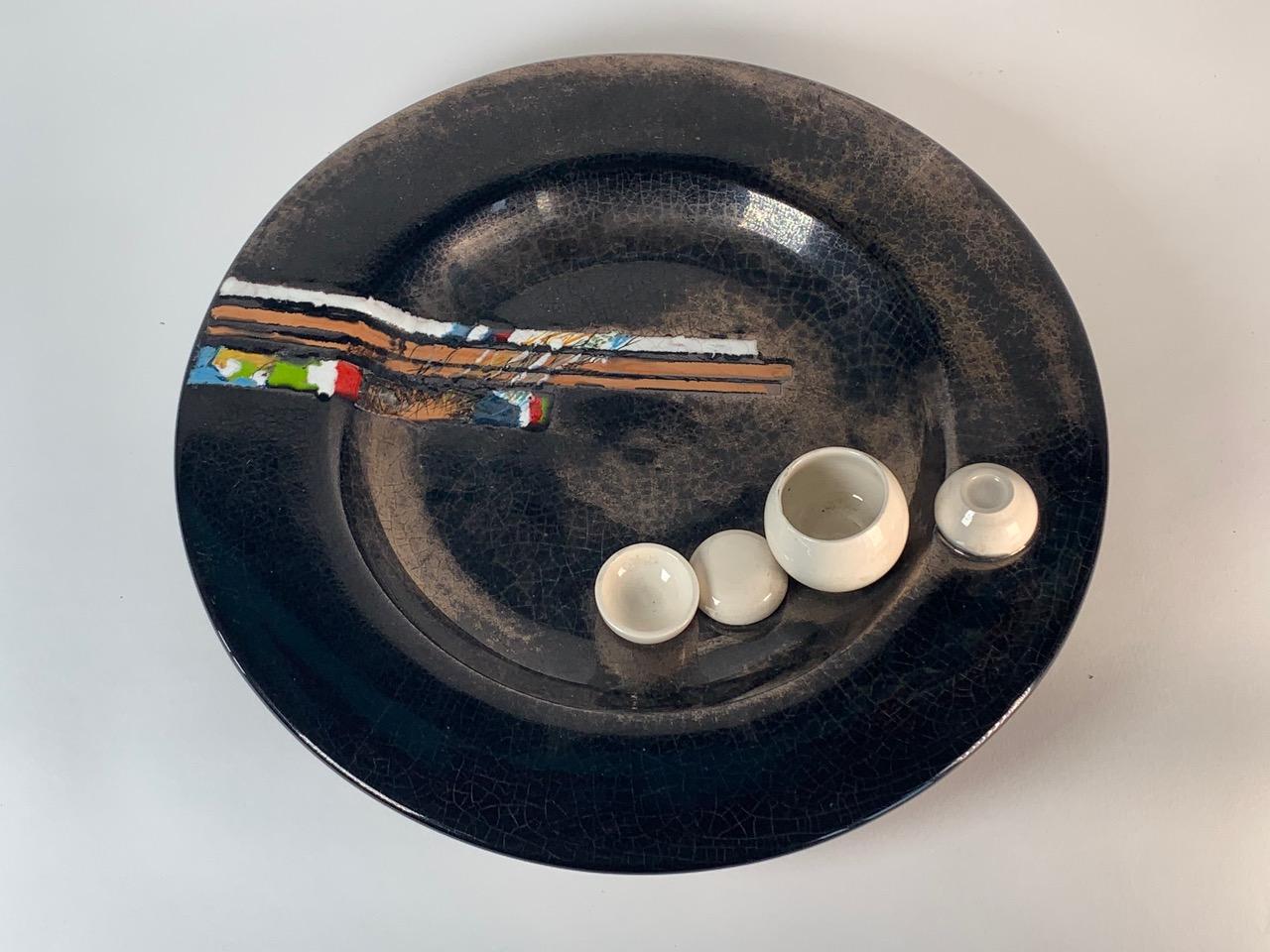 Polychrome ceramic plate designed by Carlo Carlè. Single piece. Signed.

Biography
The ceramist Carlos Carlé was born in Oncativo, Argentina, in 1928 and approached ceramics at his father's refractory factory. In 1938 he moved with his family to