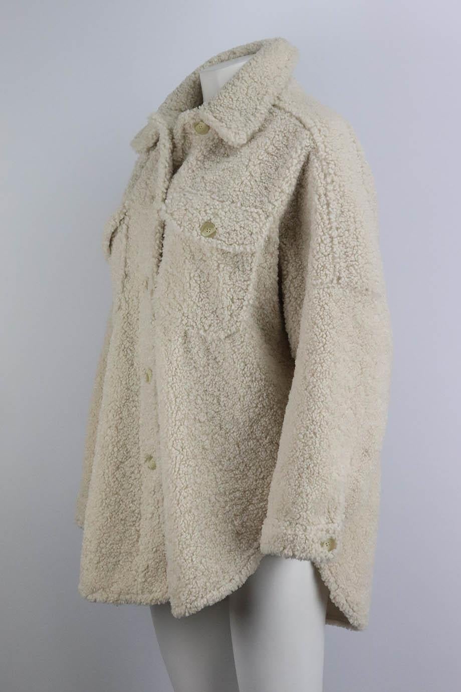 A.L.C. oversized faux shearling jacket. Made from cream soft faux-shearling in an oversized shacked style. Cream. Long sleeve, crewneck. Button fastening at front. 100% Polyester; body lining: 51% polyester, 49% cotton; lining: 100% polyester. Size: