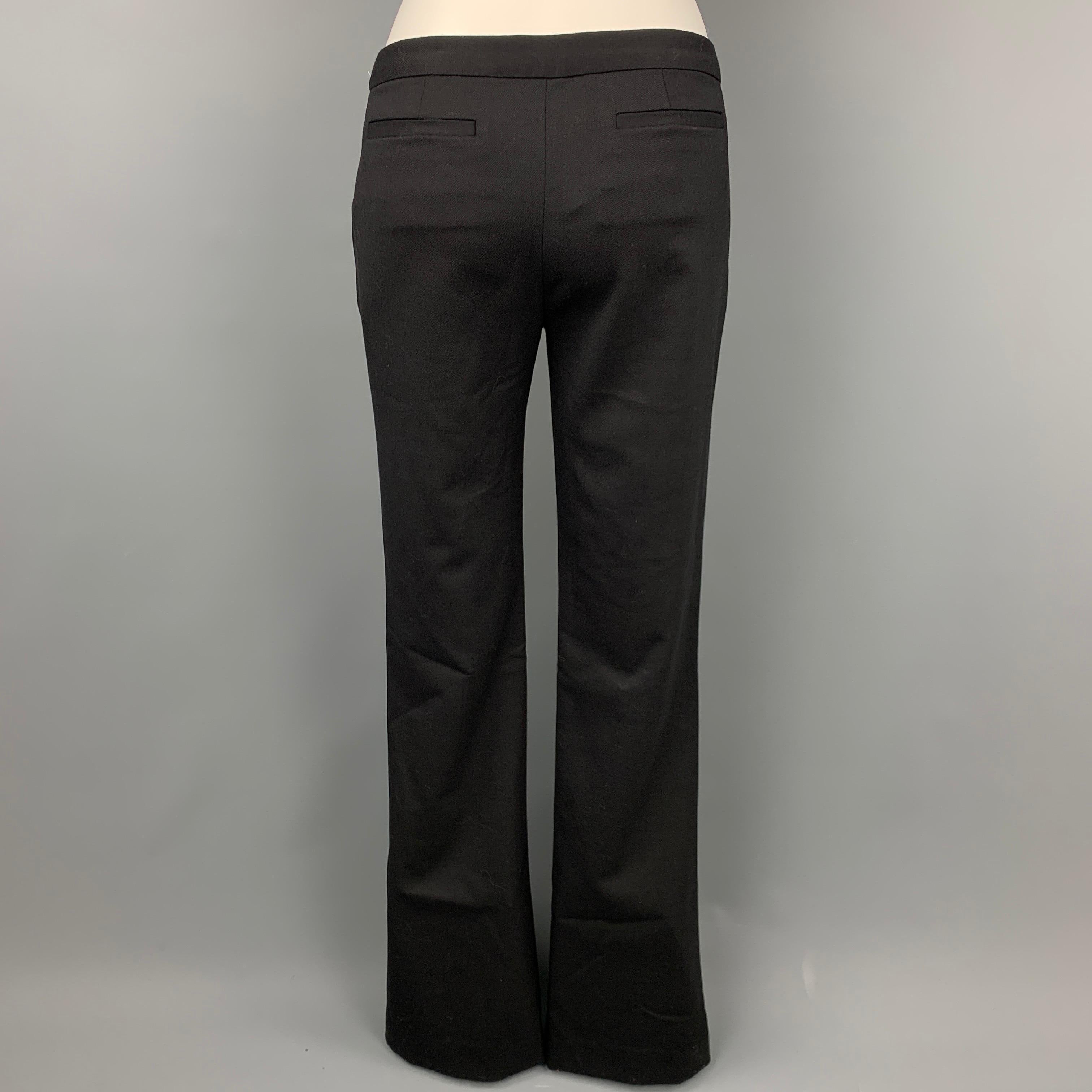 A.L.C dress pants comes in a wool blend featuring a boot cut style, front tab, and a zip fly closure. 

New With Tags. 
Marked: 6
Original Retail Price: $298.00

Measurements:

Waist: 32 in.
Rise: 8 in.
Inseam: 37 in. 