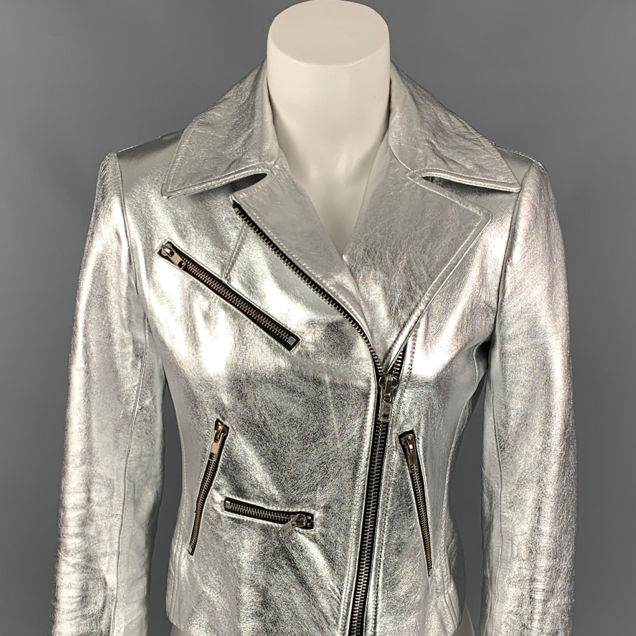 A.L.C jacket comes in a silver metallic leather with a full liner featuring a biker style, zipper pockets, zipper sleeve details, and a full zip up closure. 

Very Good Pre-Owned Condition.
Marked: 2

Measurements:

Shoulder: 15.5 in.
Bust: 35