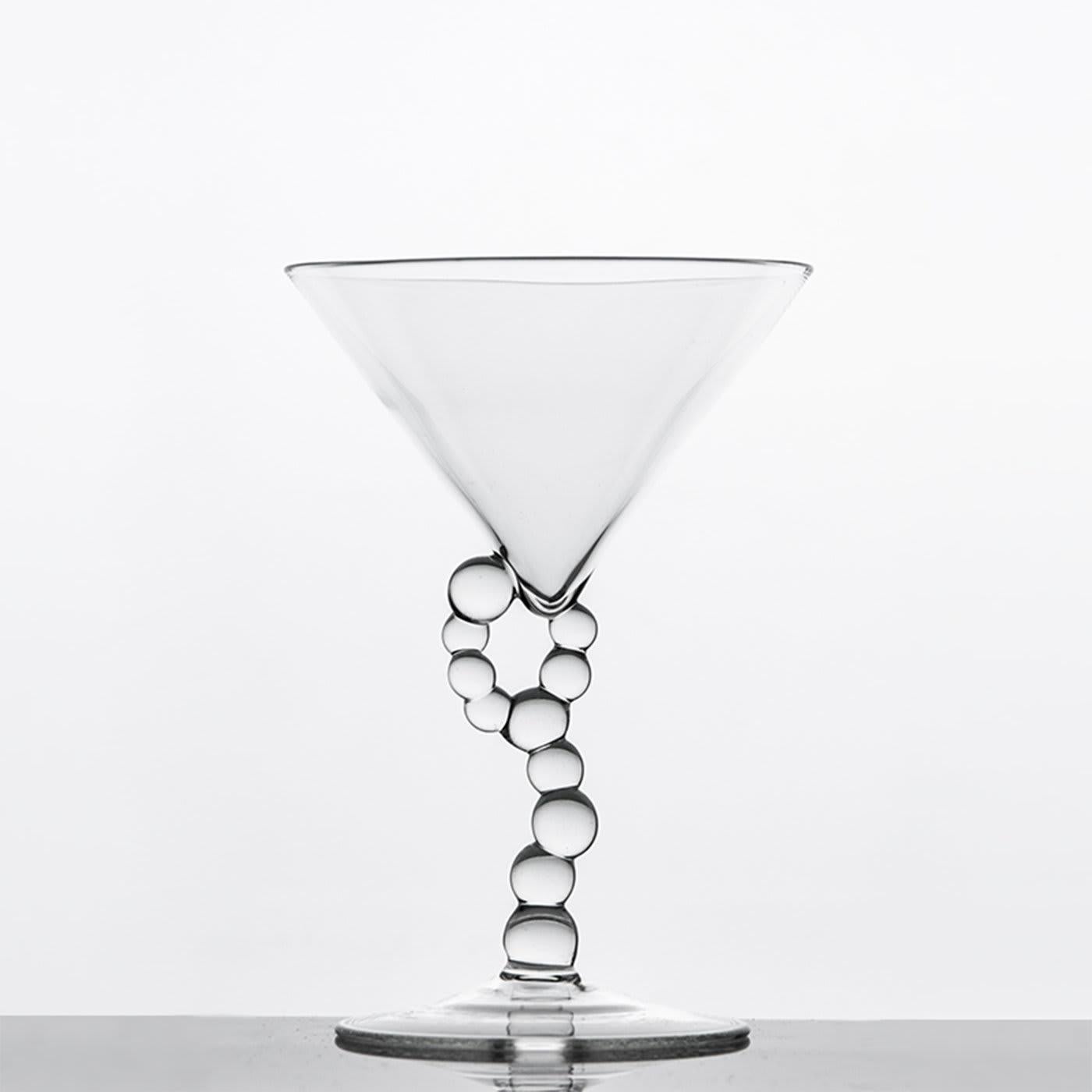 A collection composed of bottles, wine glasses, cocktail glasses and whiskey glasses, born from an ironic reinterpretation of chemical laboratory glassware. Vials, test tubes, funnels, and cylinders are
transformed into domestic objects, from which