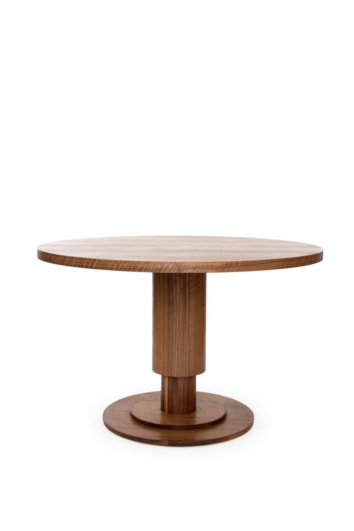 Strong pillar like base inspired in Mexico City’s independence monument, created by French/Italian sculptor Enrique Alciati, thus, the name ‘Alciati Table’. Conceived from concentric wood cylinders adding a sense of different layers and dimension,