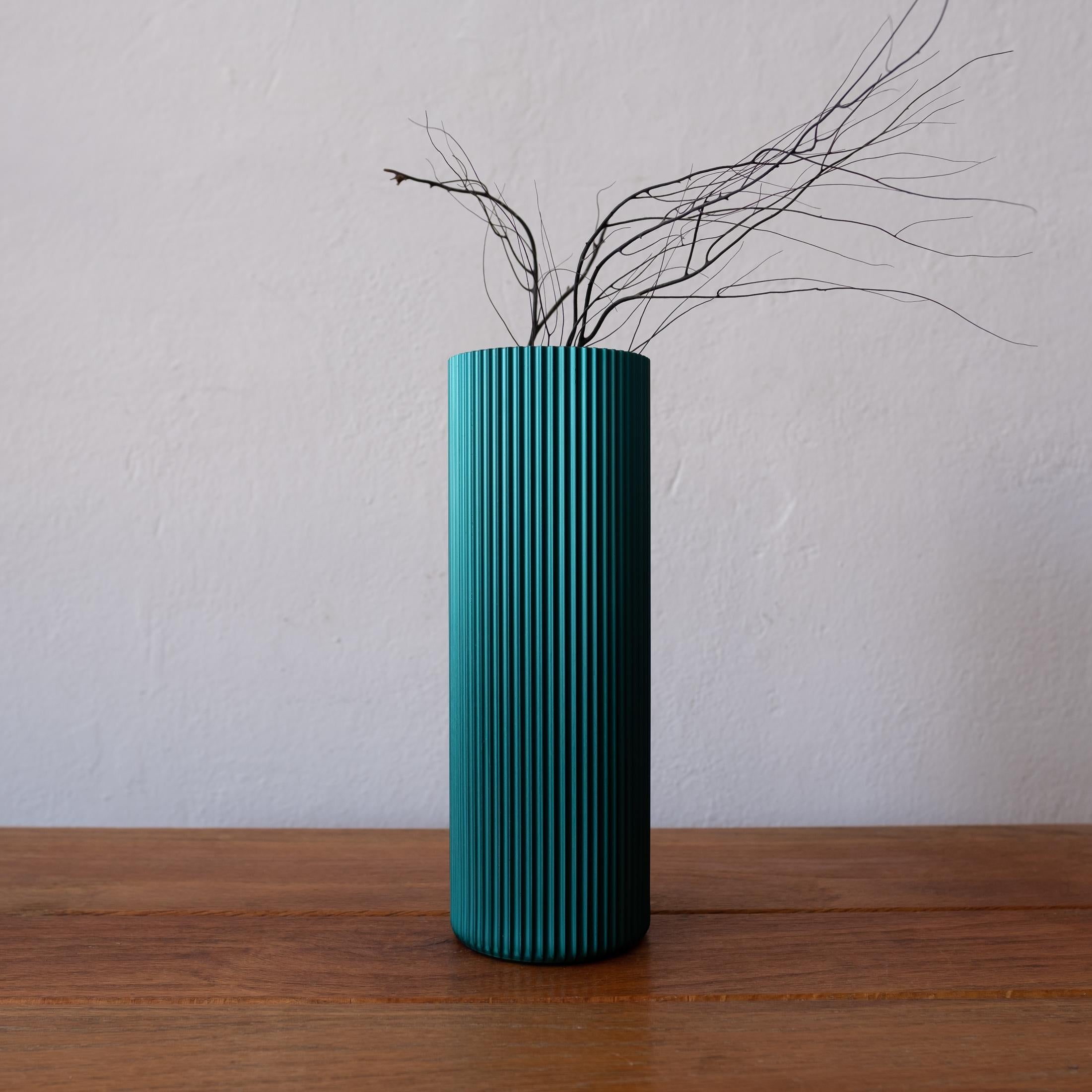 Extruded and anodized aluminum vase, which was introduced as part of the Alcoa Design Forecast program in 1959. The project, which included two books, promoted the use of aluminum in design. Alcoa's Design Forecast program showcased design-oriented