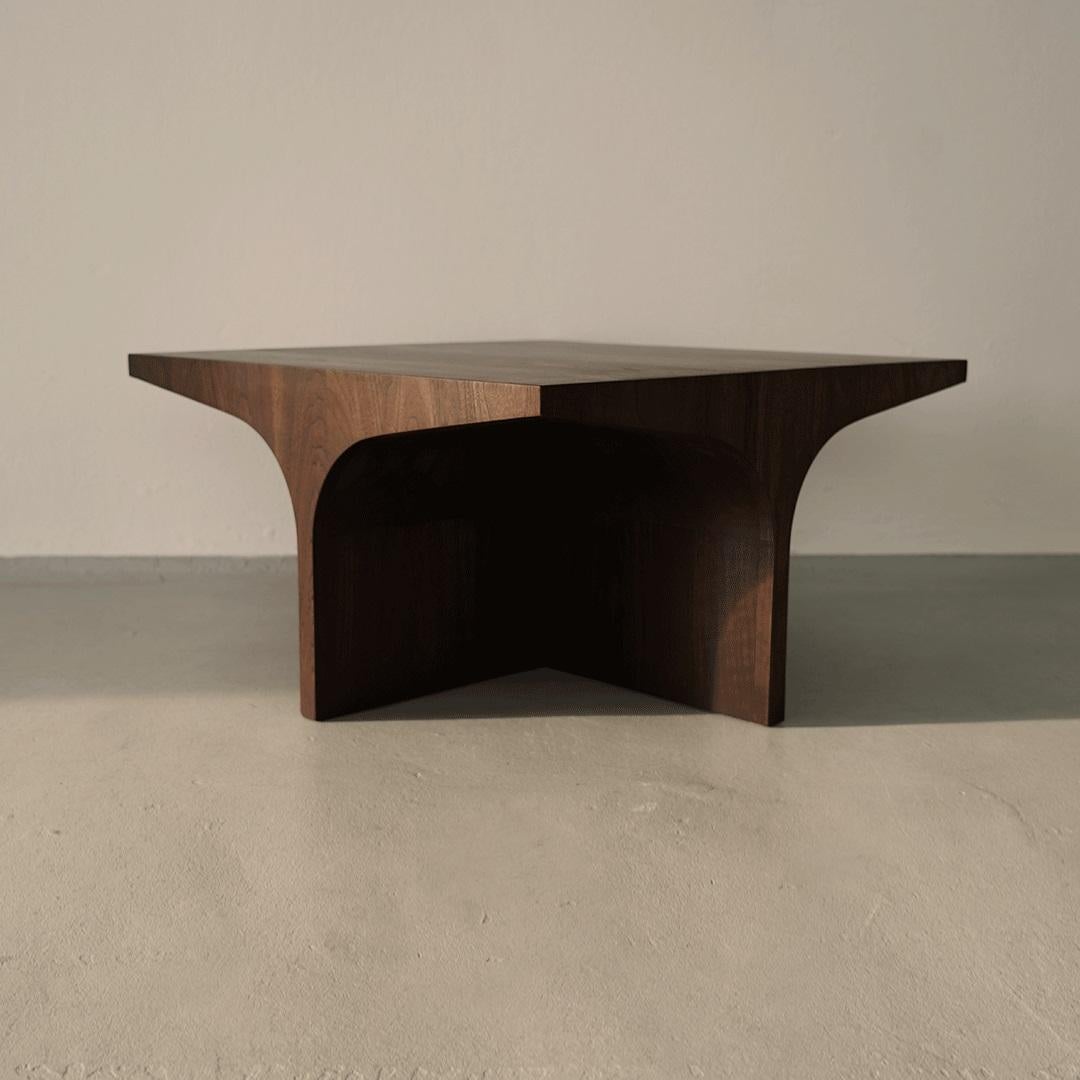 Alcoba Coffee Table by Selma Lazrak
Dimensions: D 75 x W 75 x H 40 cm 
Materials: Solid American walnut.

The table is inspired by organic forms founded in the Sahara desert and the architecture of the land.
The meaning of the world Alcoba in Arabic