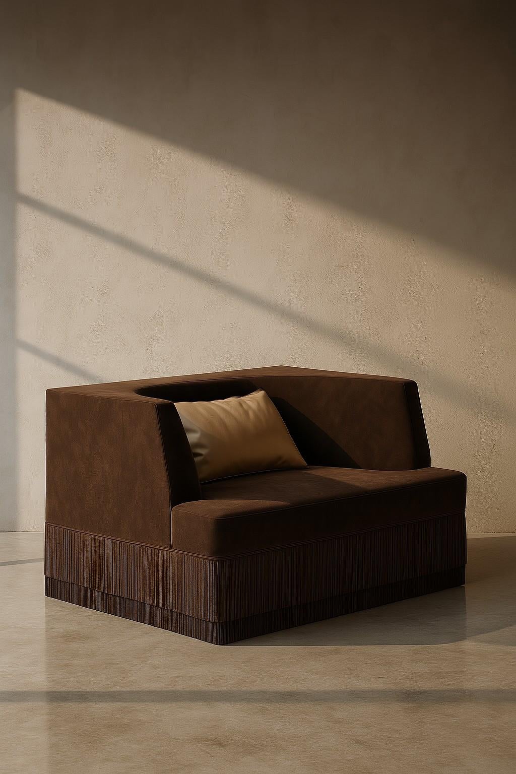 A sculptural statement piece defined by its architectural silhouette and introspective form. The Alcove Sofa embraces a bold exterior — rectangular and linear — that gently reveals a soft, concave inner curve. The design evokes the feeling of a