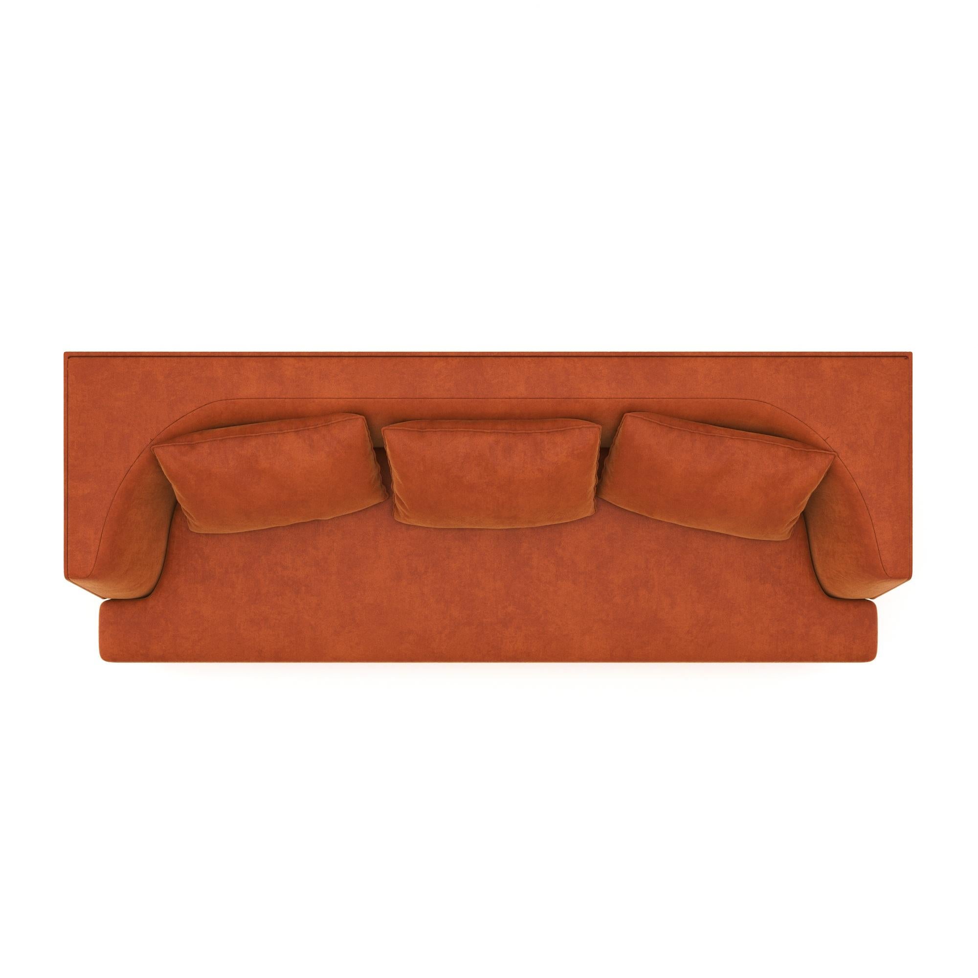 A sculptural statement piece defined by its architectural silhouette and introspective form. The Alcove Sofa embraces a bold exterior — rectangular and linear — that gently reveals a soft, concave inner curve. The design evokes the feeling of a