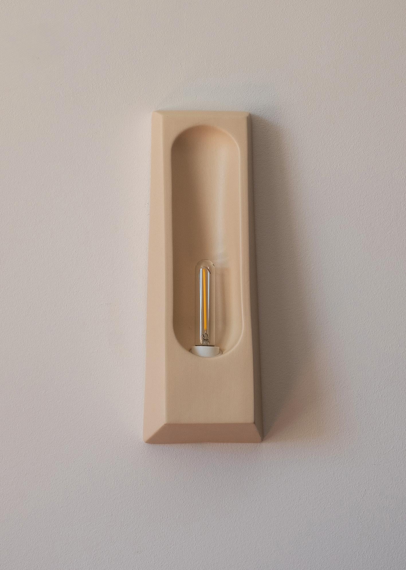 Introducing the Alcoves, a collection of elegant ceramic wall sconces designed to enhance contemporary interiors with their delicate blend of art and functionality. Handcrafted in Portugal, these lights draw inspiration from architectural alcoves,