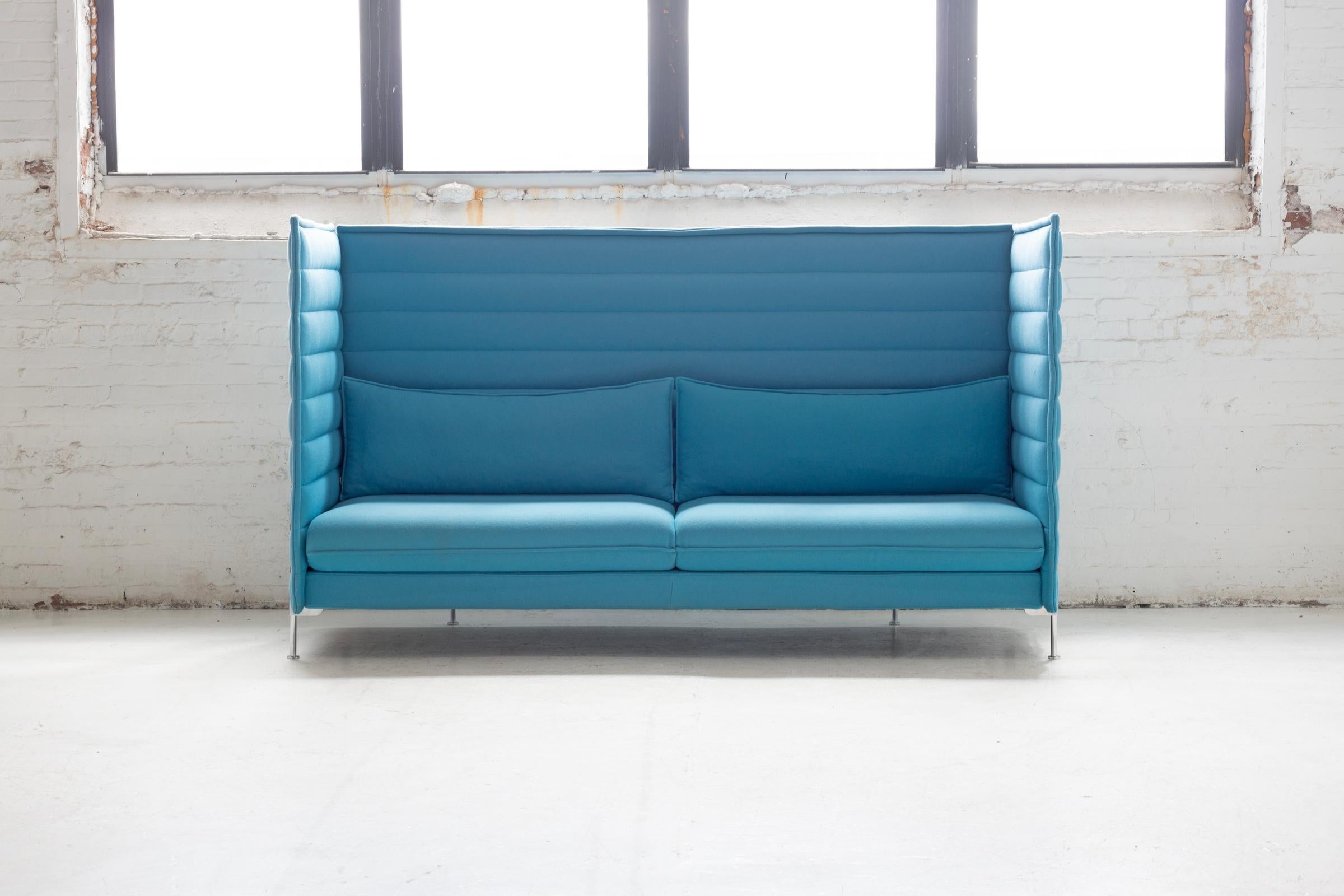 A striking example of contemporary design, this Alcove sofa comes in a serene sky-blue upholstery that instantly brightens any space. Designed by Ronan & Erwan Bouroullec, the Alcove line is celebrated for its high side and back panels, creating a