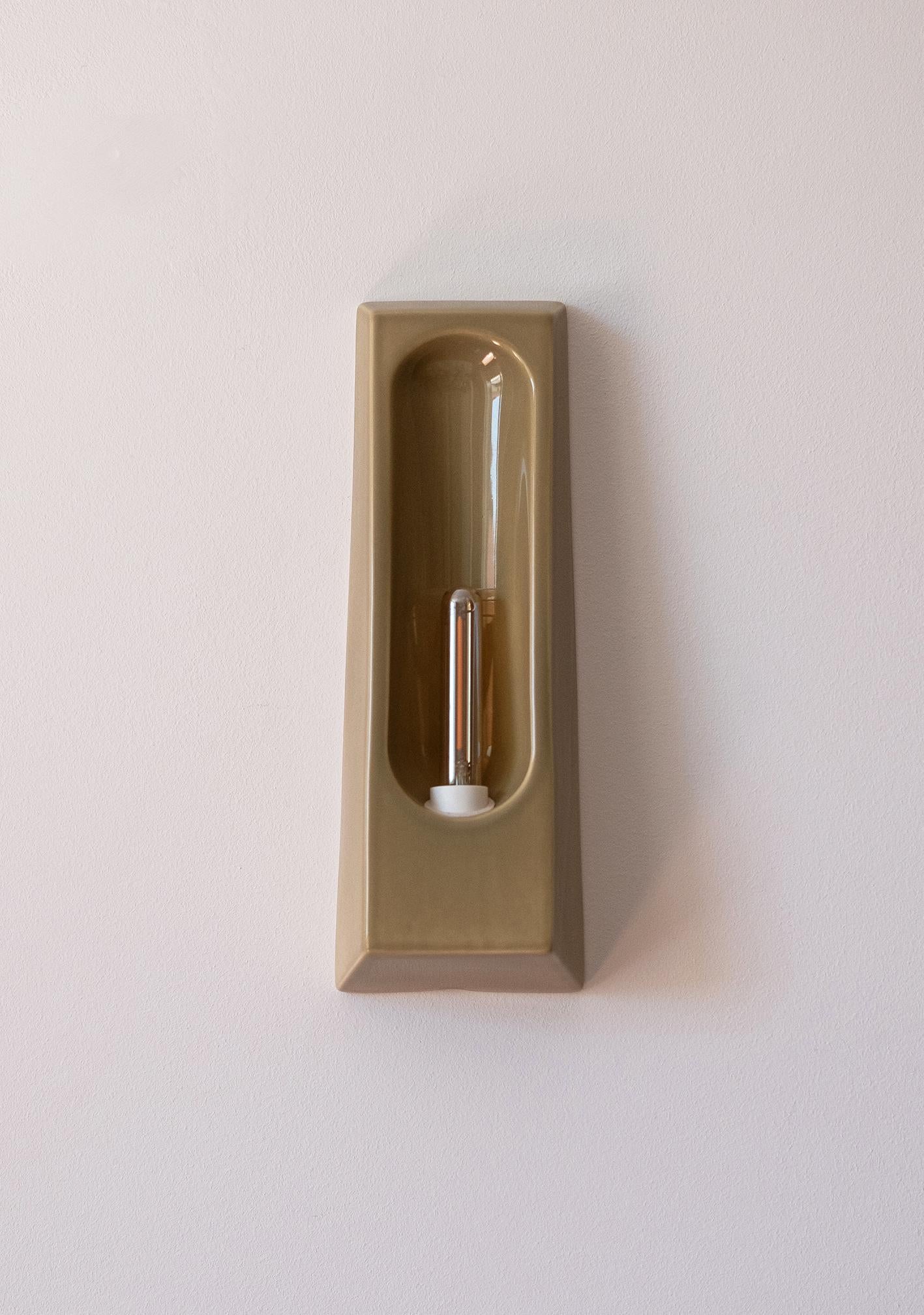 Introducing the Alcoves, a collection of elegant ceramic wall sconces designed to enhance contemporary interiors with their delicate blend of art and functionality. Handcrafted in Portugal, these lights draw inspiration from architectural alcoves,