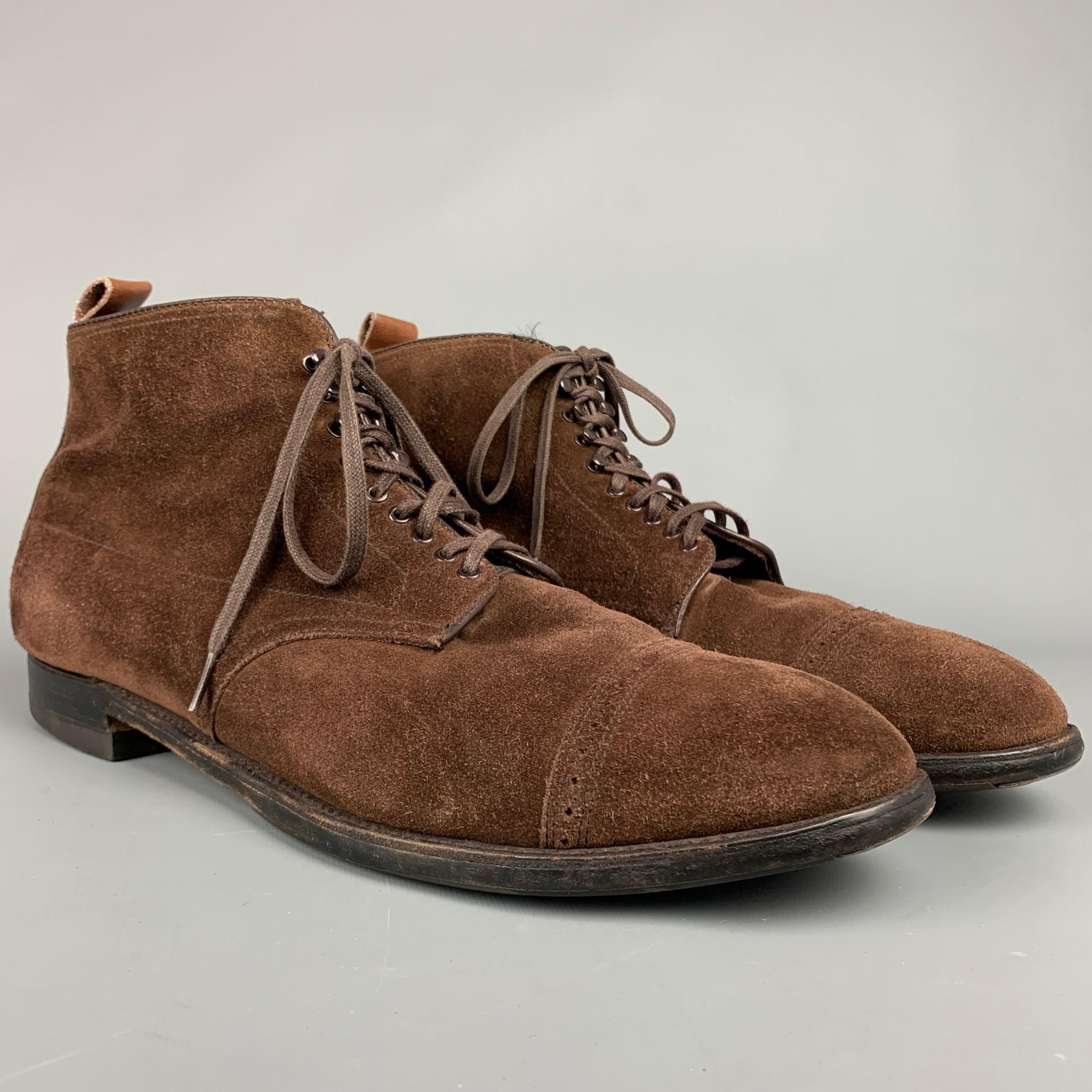 ALDEN boots comes in a brown suede leather featuring a cap toe, wooden sole, and a lace up closure. Comes with box, but not original. Made in England.

Very Good Pre-Owned Condition.
Marked: 15 / 4196

Measurements:

Length: 13.5 in.
Width: 4.5