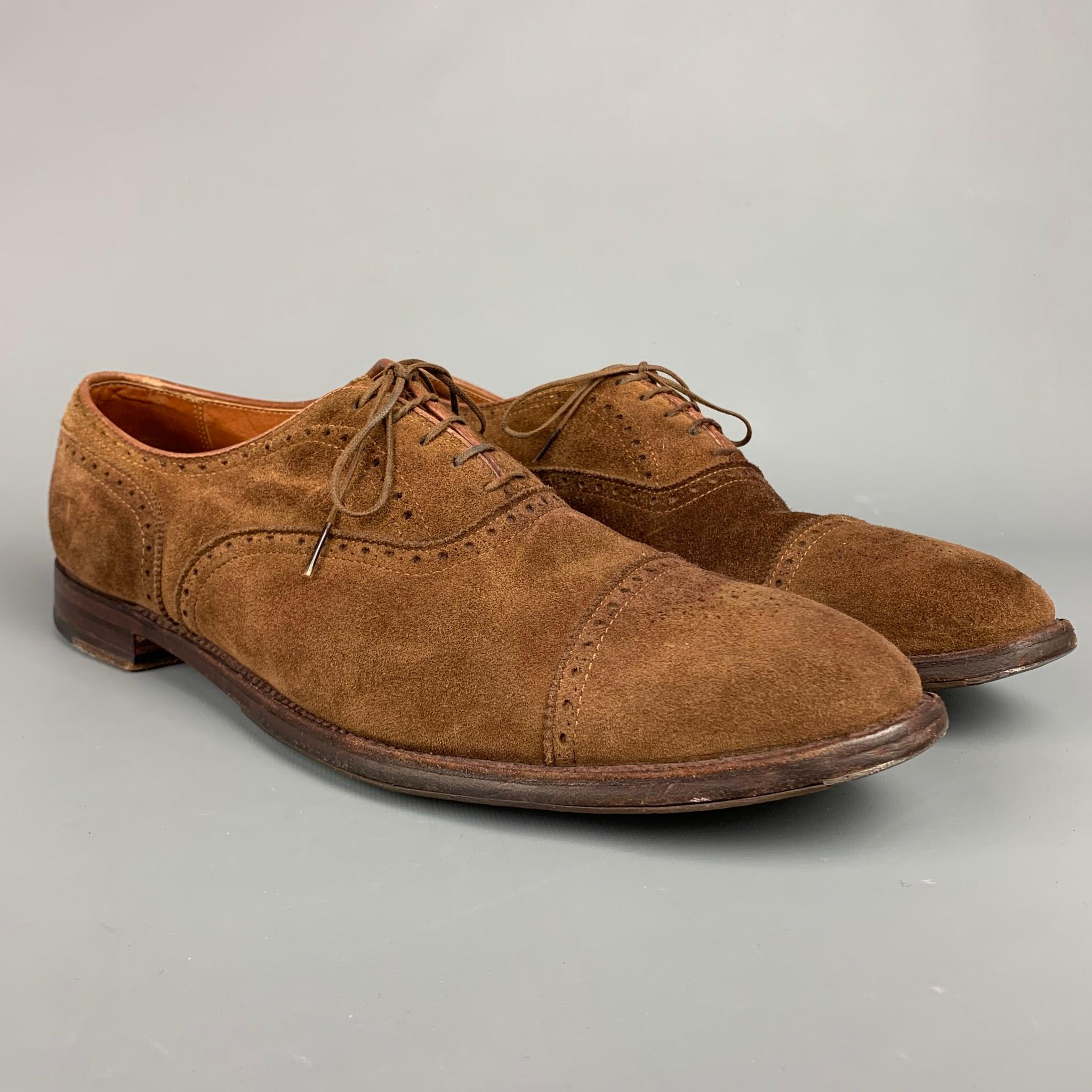 ALDEN lace up shoes comes in a brown perforated suede featuring a cap toe and a wooden sole. Comes with box. Made in England. 

Very Good Pre-Owned Condition.
Marked: 15 A / 51670F

Outsole: 13.5 in. x 4.5 in.