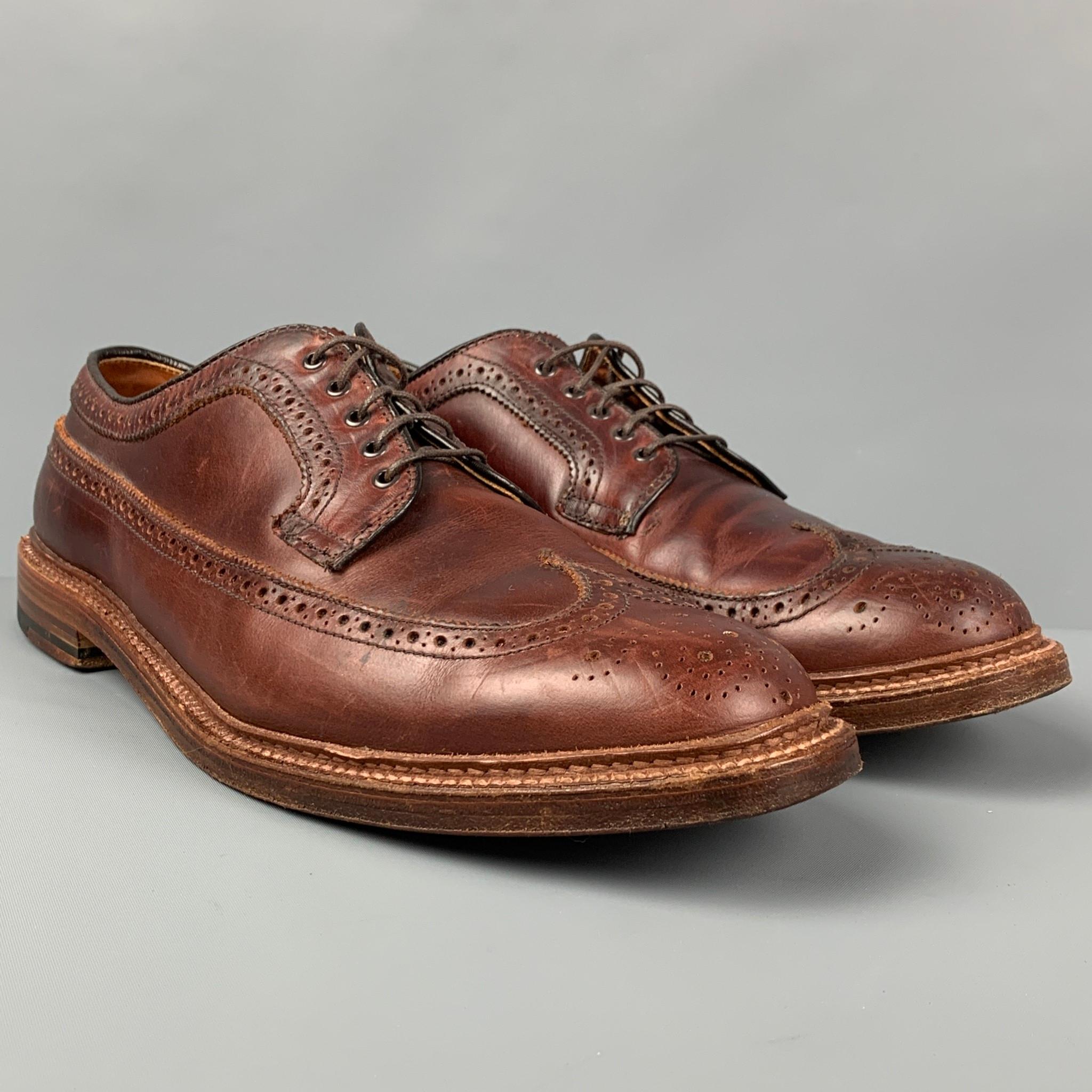 ALDEN shoes comes in a brown leather featuring a wingtip style and a lace up closure. 

Very Good Pre-Owned Condition.
Marked: 11 B/D

Outsole: 13 in. x 4.5 in. 