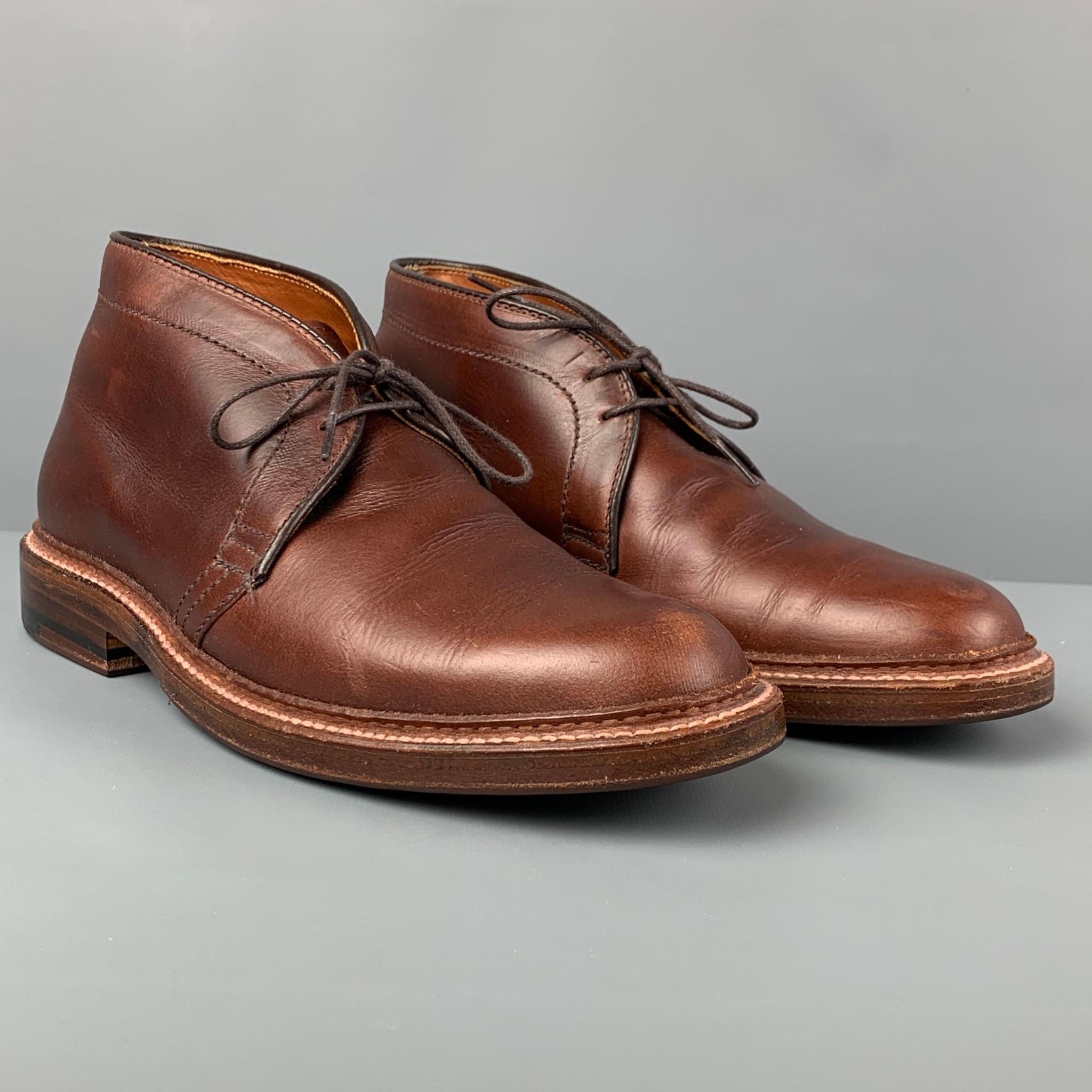 ALDEN boots comes in a brown leather featuring a chukka style and a lace up closure. Comes with box and shoe trees. Made in USA. 

Very Good Pre-Owned Condition.
Marked: 6.5 B/D 0B03 026 13781

Measurements:

Length: 11.5 in.
Width: 4 in.
Height: 4