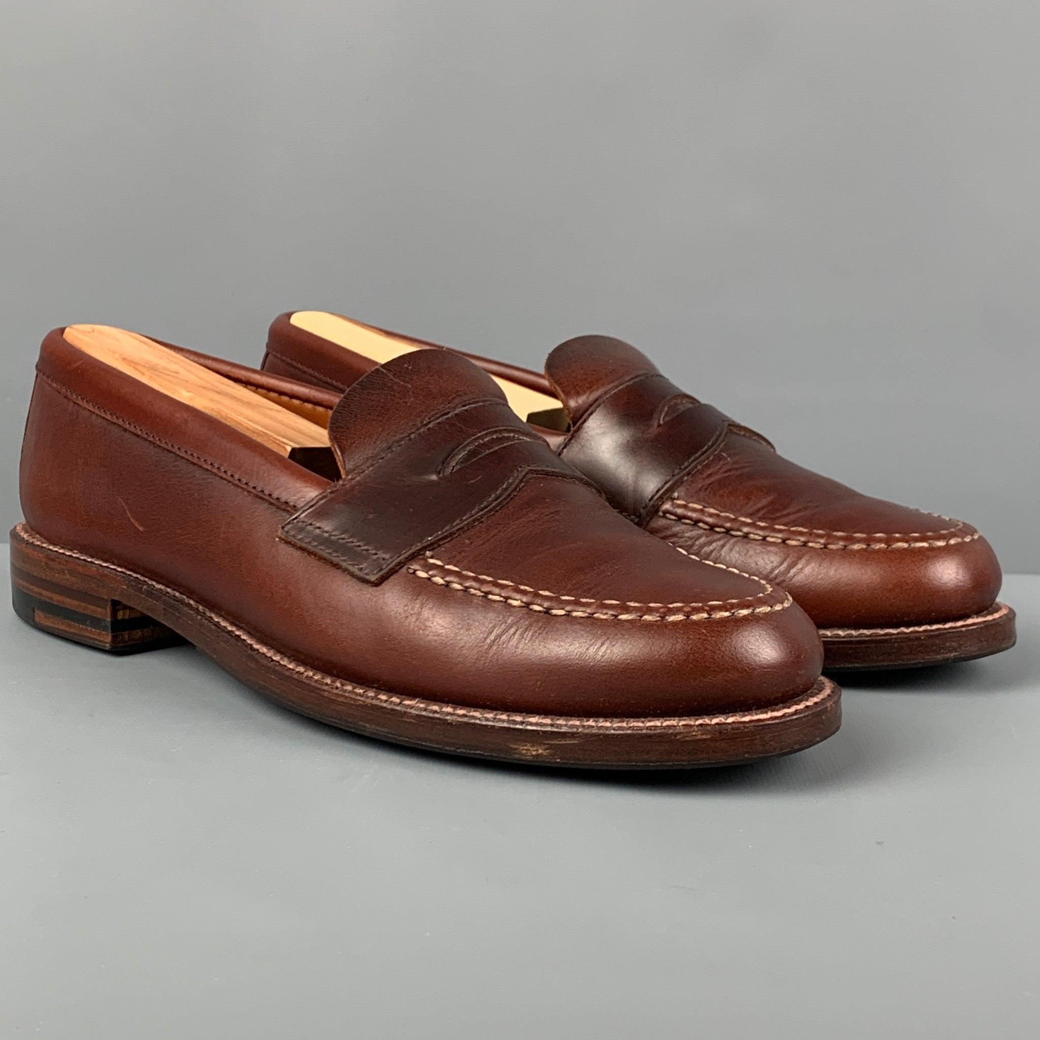 ALDEN loafers comes in a brown leather featuring contrast stitching, slip on style, and a penny strap. Comes with box and shoe trees. Made in USA.
Very Good
Pre-Owned Condition. 

Marked:   6.5 178317Outsole: 10.75 inches  x 3.75 inches 
  
  
