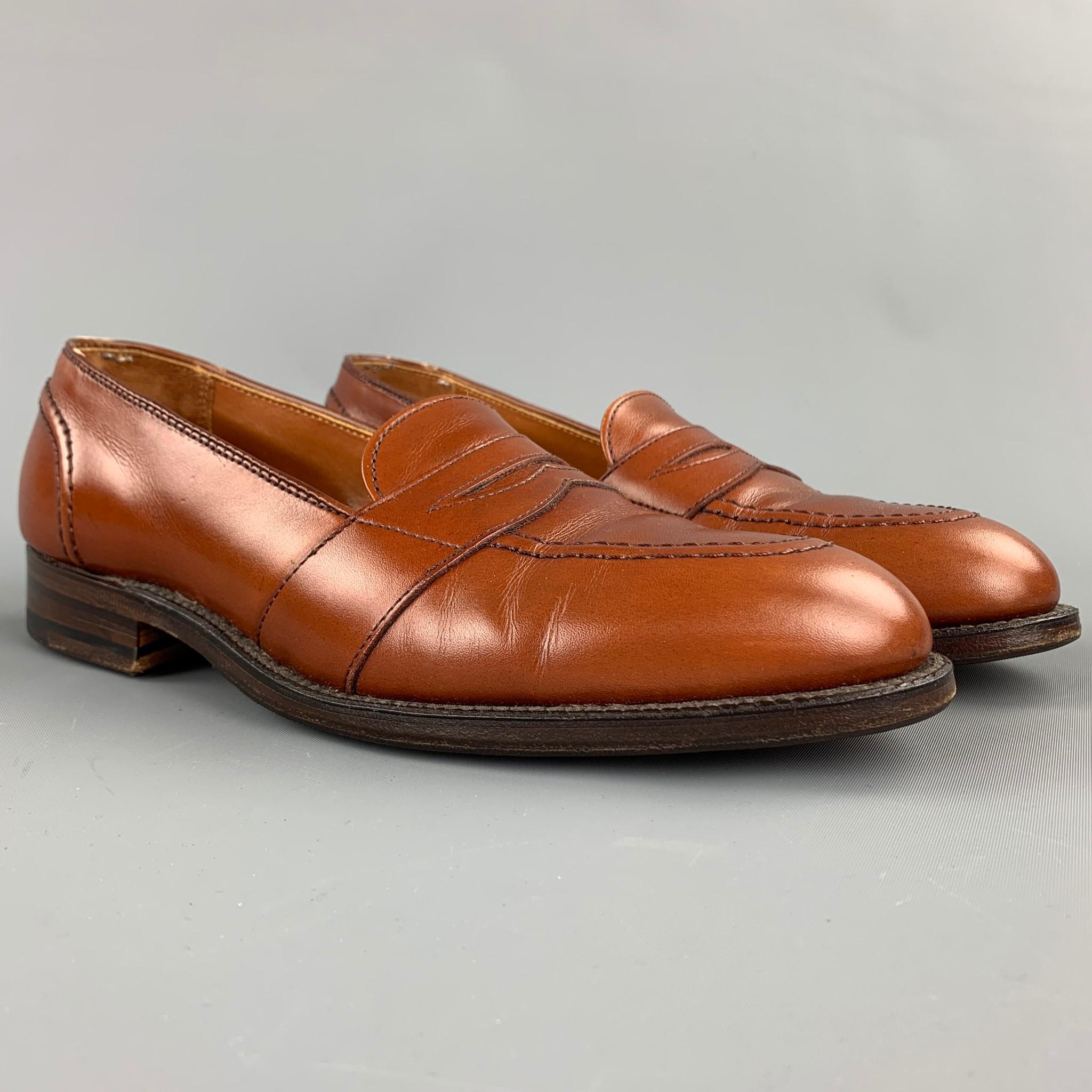 ALDEN loafers comes in a tan leather featuring a penny strap, top stitching, leather insole, and a wooden sole. Made in USA.

New With Box. 
Marked: 7 B  685

Outsole: 11 in. x 4 in. 