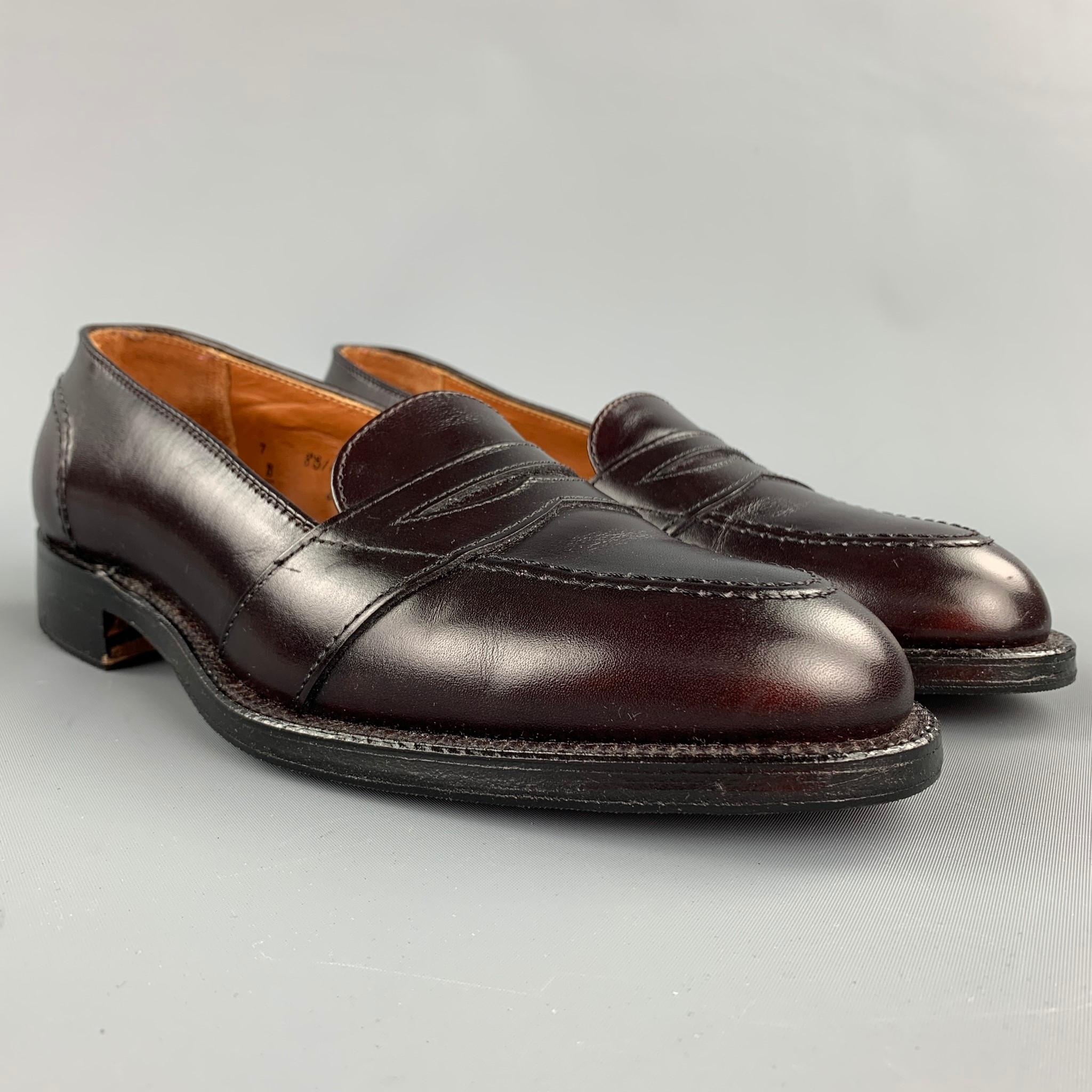 ALDEN loafers comes in a burgundy leather featuring a penny strap, leather insole, and a wooden sole. Made in USA.

New With Box. 
Marked: 7 D 683

Outsole: 11 in. x 4 in. 