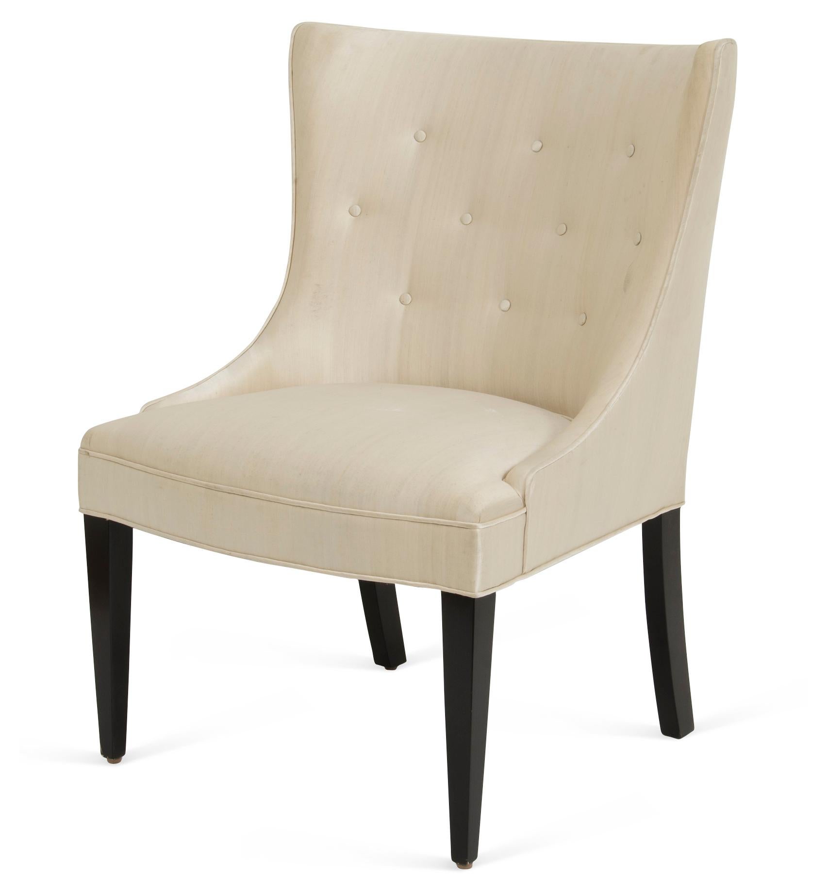 The upholstered 1940's style chair with a concave tufted back and tapered legs is hand-crafted, frame in alder wood. Custom sizes and finishes available.