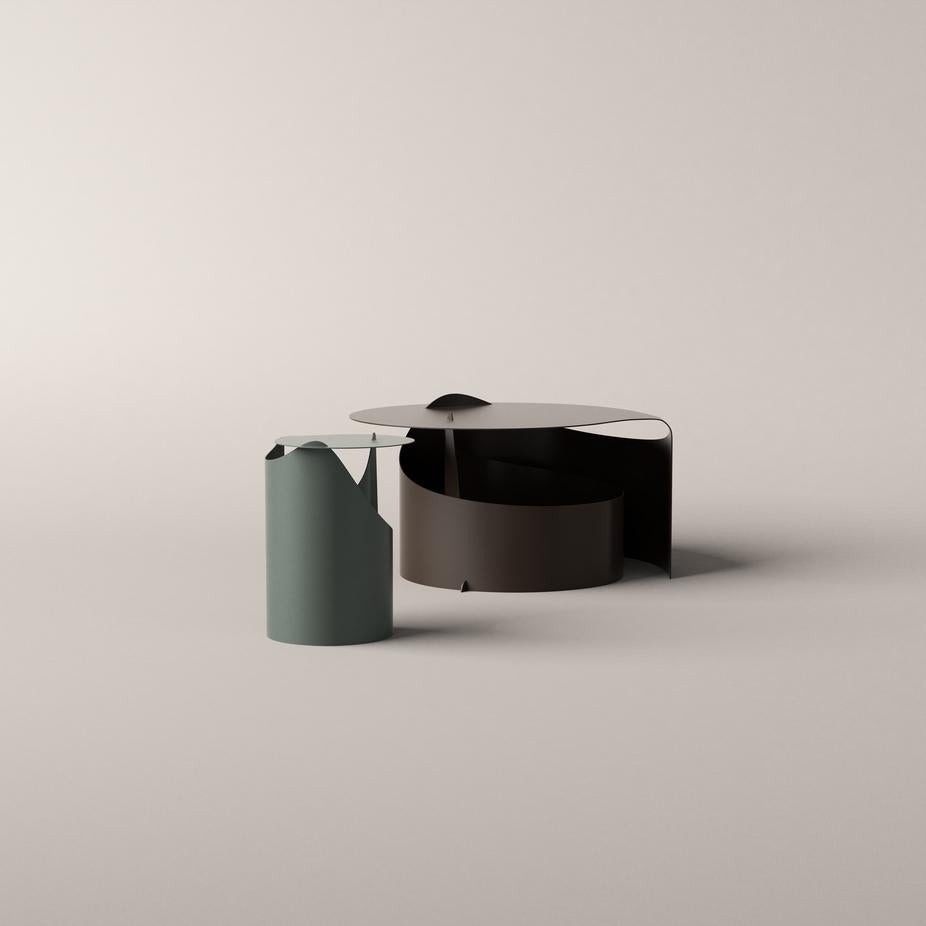 Aldo Bakker Two Set Coffee Table Lounge For Karakter 

A single sheet of steel rolled in one smooth motion into a self-supporting construction. Aldo Bakker’s exquisite sense of merging colour, material and form has come into play to create an
