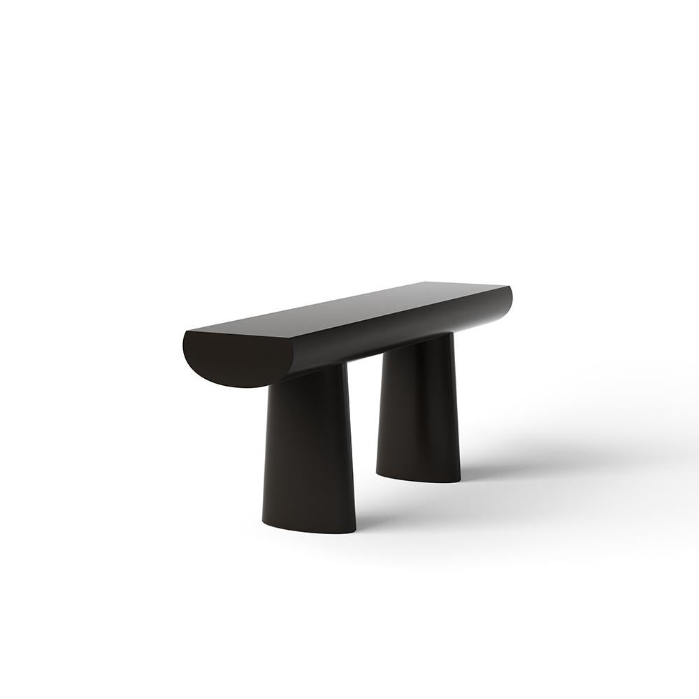 Console table designed by Aldo Bakker in 2017. 

Tranquil and seductive, Aldo Bakker’s console table floats exquisitely between sculpture and furniture. It depicts the simplest concept of a table: two columns and a surface. The legs are an