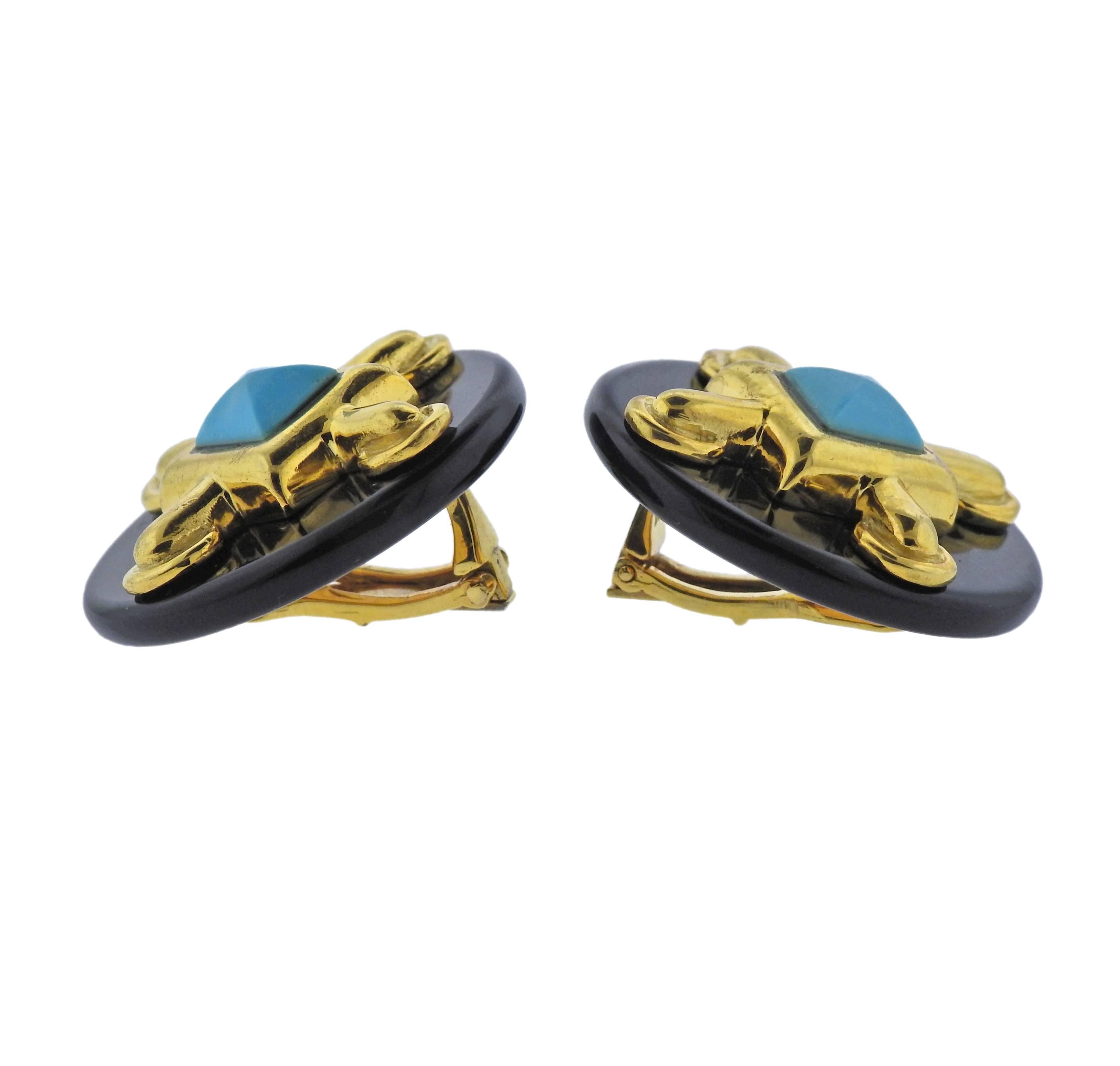 Pair of 18k yellow gold earrings, designed by Aldo Cippulo in circa 1973, set with onyx top and turquoise. Earrings are 27mm in diameter, weigh 32.1 grams. Marked:  A.Cipullo, 1973. 
