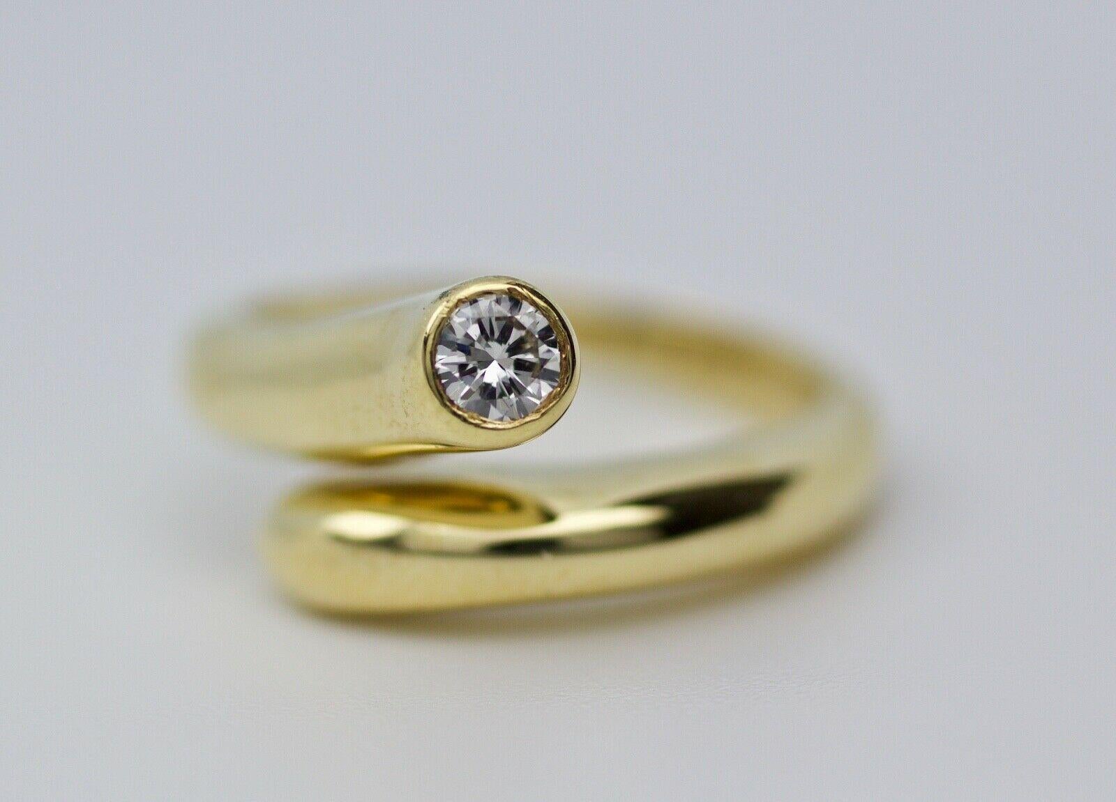 This is an Aldo Cipullo 18k yellow gold diamond ring. Aldo Cipullo was the maker for Cartier rings back in the 1970's. This ring is size 6 and weights in at 6 grams. The diamond is 0.25 carats and is an F color and VS1 clarity. This ring is a truly