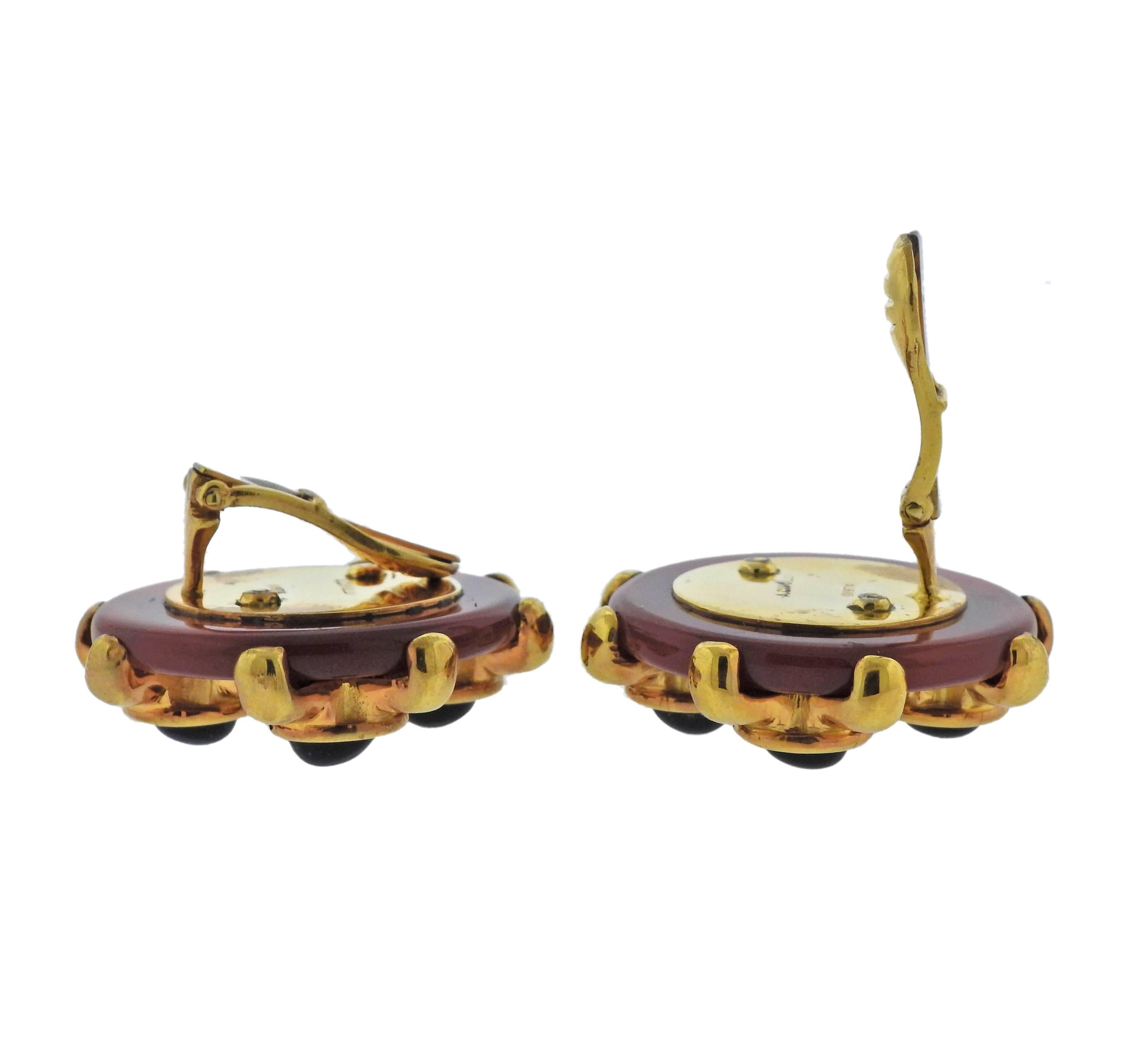 Pair of 18k yellow gold earrings, designed by Algo Cipullo in circa 1974, set with carnelian top and black onyx. Earrings are 30mm in diameter , weigh 41 grams. Marked:  A.Cipullo, 1974. 