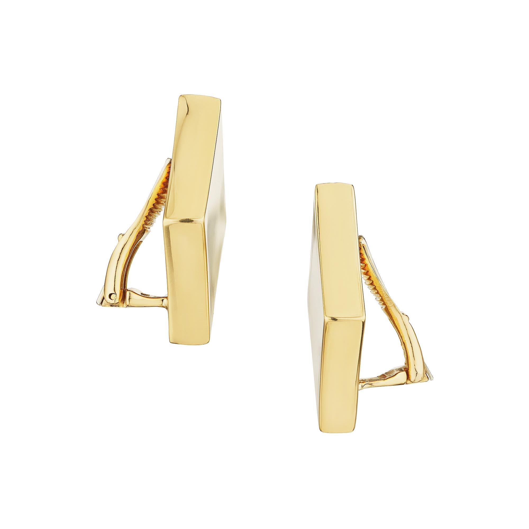 The diamond symbol is one of the four French suits of playing cards which symbolize wealth and financial success, and these Aldo Cipullo for Cartier modernist 18 karat yellow gold parallelogram clip earrings are a rare treasure.  Signed Cartier A.