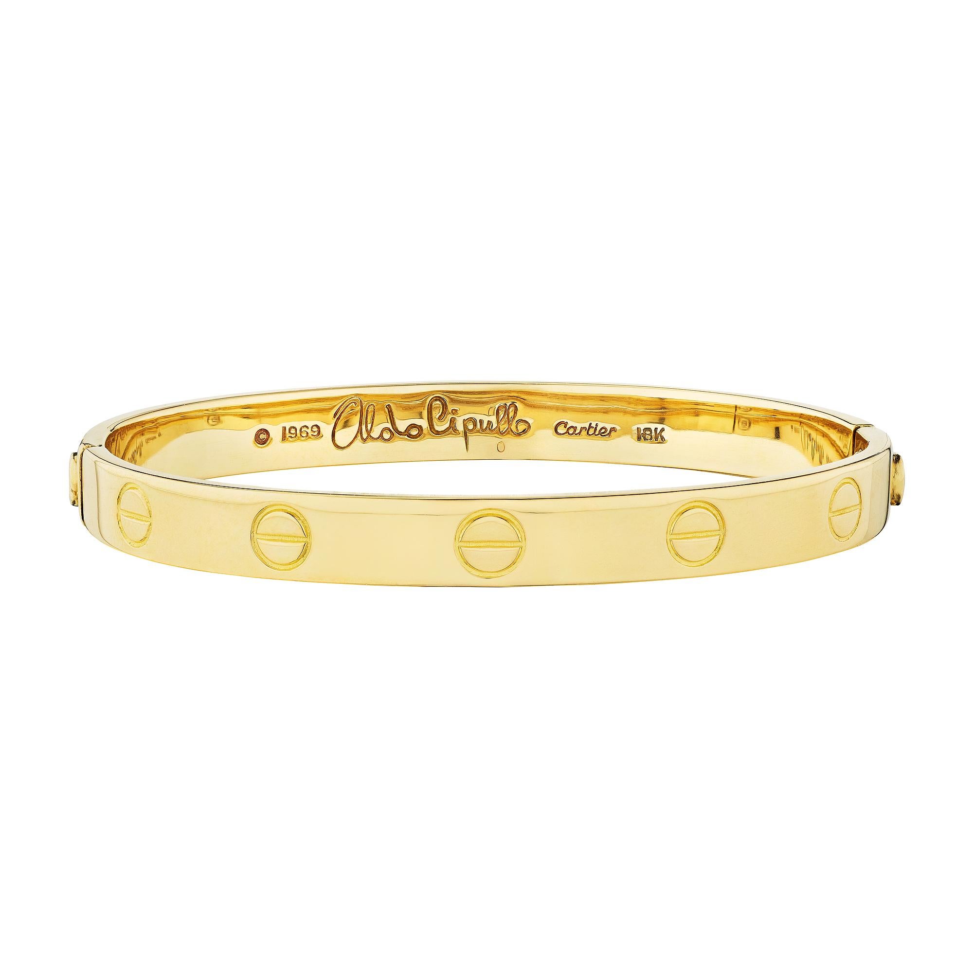 Be the first.  This signed Aldo Cipullo by Cartier 18 karat yellow gold 'LOVE' bangle bracelet was one of the first designed and manufactured in 1969.  Stamped with the date 1969, this size 15 Aldo Cipullo bracelet will always push you to the head