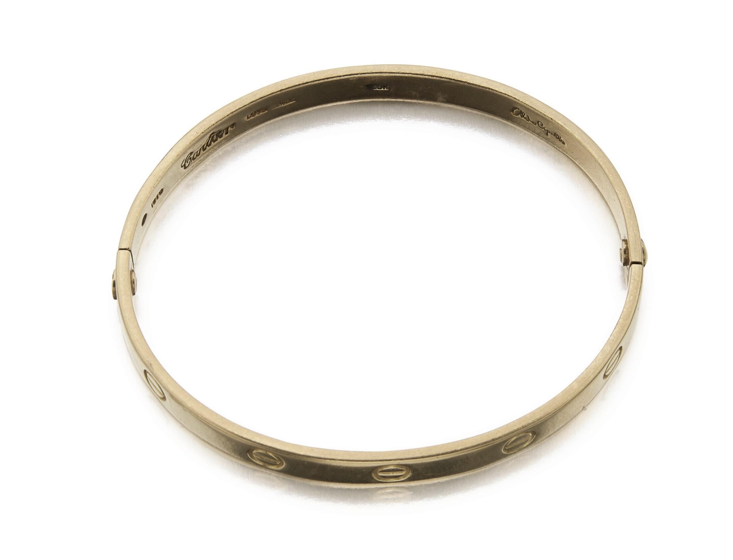 Aldo Cipullo For Cartier 18k Gold 'LOVE' Bangle Bracelet

The hinged bangle decorated with screw motifs, weight 32.8 grams.
Internal circumference is 7 inches.
Signed Cartier Aldo Cipullo, 1970.

In excellent condition