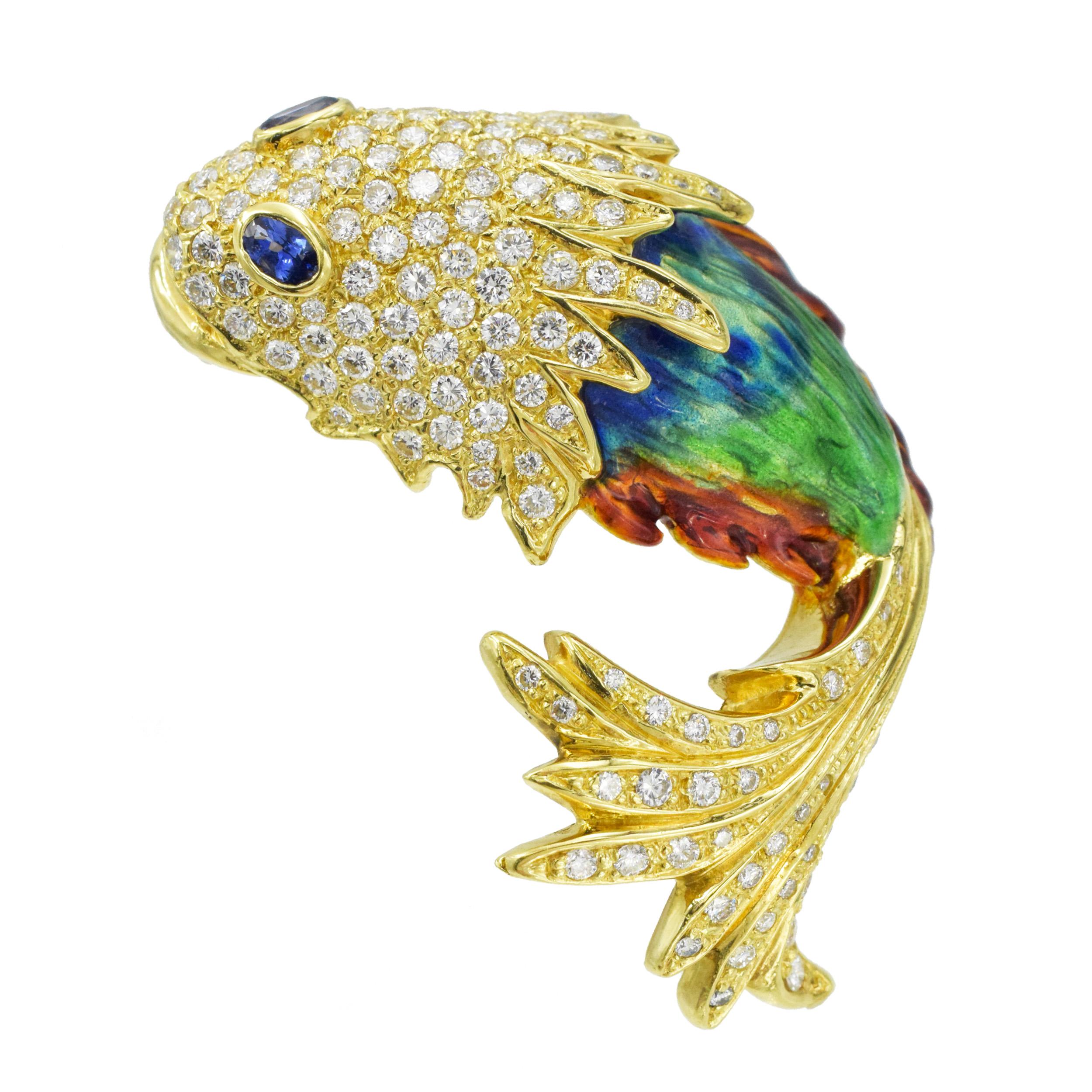 Aldo Cipullo for Cartier Sapphire, Diamond and colorful fish brooch crafted in 18k yellow gold. The brooch is designed as a fish with its head and tail encrusted with pave set round brilliant
cut diamonds with total weight of approximately 5.65ct,