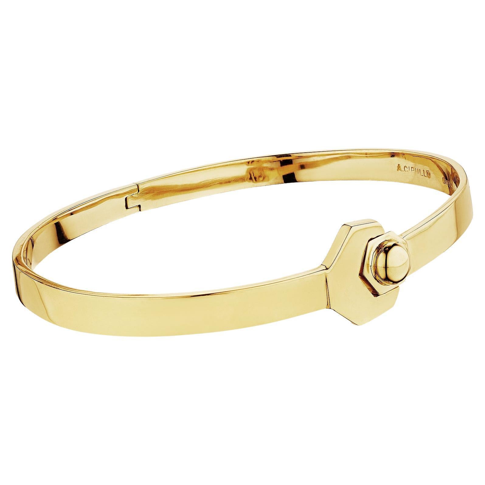 This is no monkey wrench.  Just an authentic and very rare Aldo Cipullo modernist gold 'wrench' designed bangle bracelet.  Signed A. Cipullo.  Stamped with date 1974.  18 karat yellow gold.  Fits average wrist size.  Opens with hinged back. 18 karat