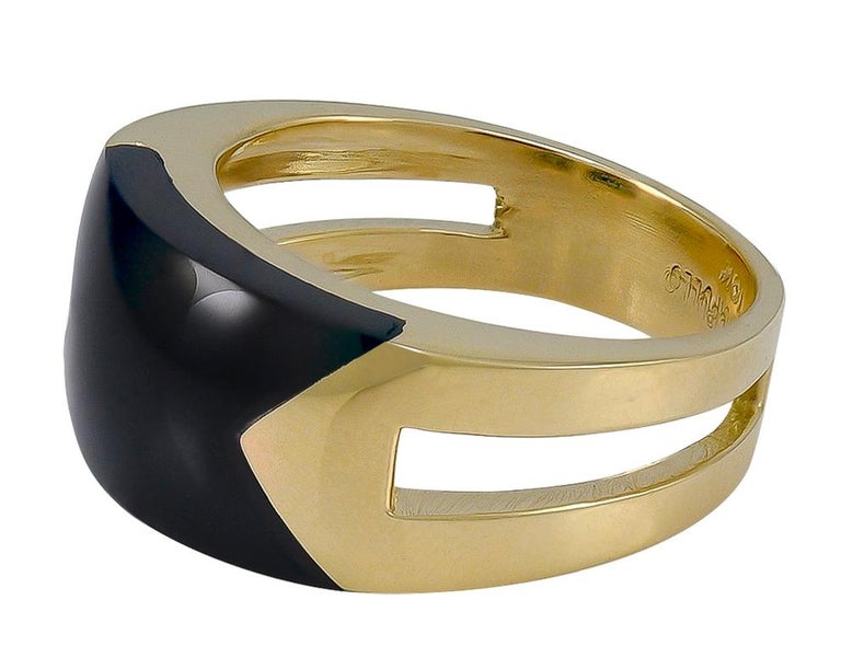 Sleek and chic gold and onyx ring.  Made and signed by ALDO CIPULLO.  An open band that wraps around the finger, with a smooth rounded beveled inlay of  onyx.  Size 6 and can be custom-sized.  A distinctive and wearable piece of jewelry.  Unusual