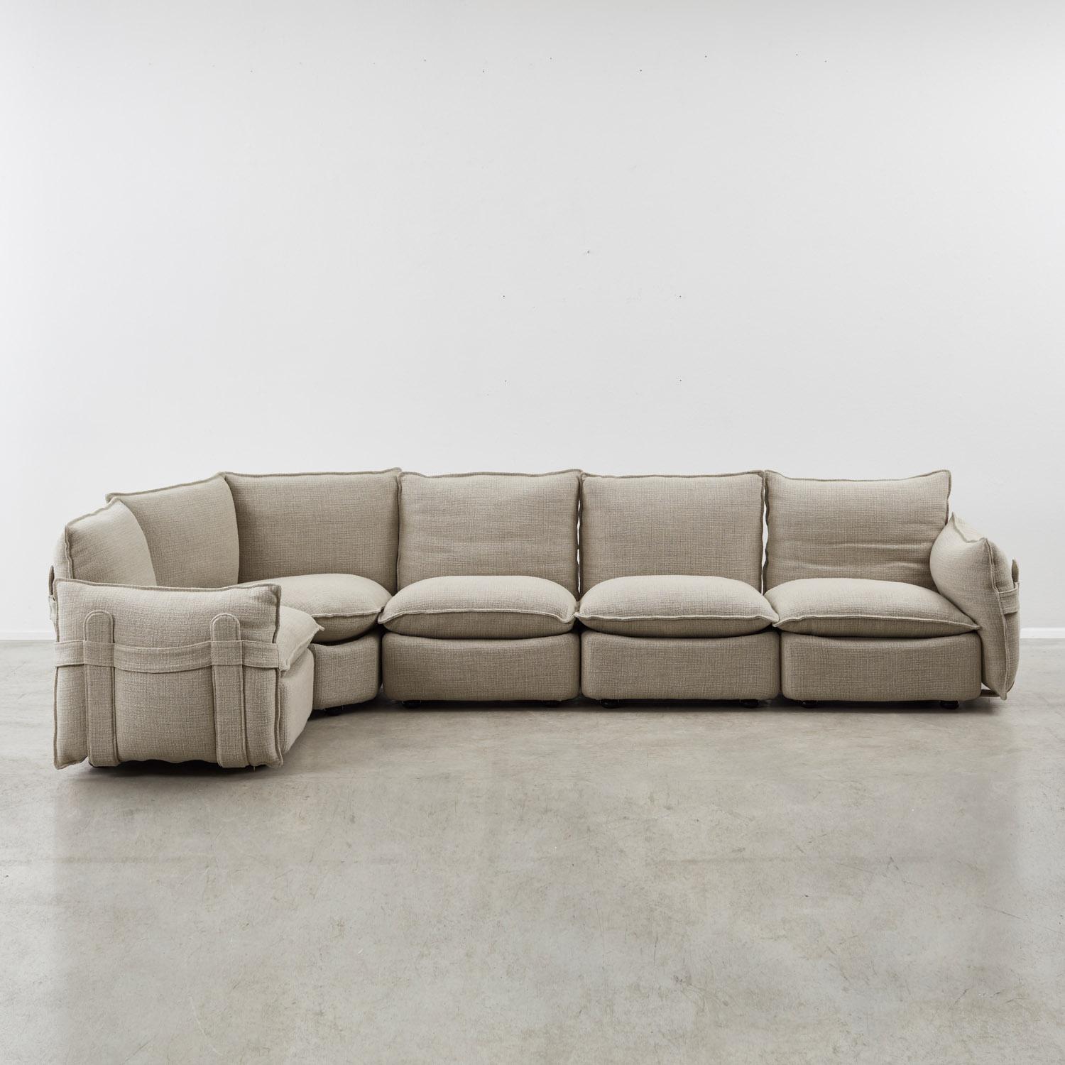 This rare modular sofa by little-known Italian designer Aldo Davico combines a louche profile typical of the period with technical interest. 

Designed for Art & Form, it comprises five distinct elements with integrated backrests, including a corner
