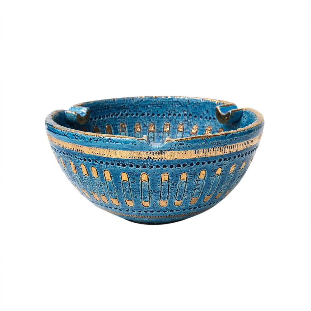 Aldo Londi Bitossi Ashtray, Ceramic, Safety Pin, Blue, Gold, Signed. Small to medium scale deep ashtray with three cigarette rests. Decorated with a pattern of gold glazed safety pins over Rimini Blue on both the interior and exterior. Signed with