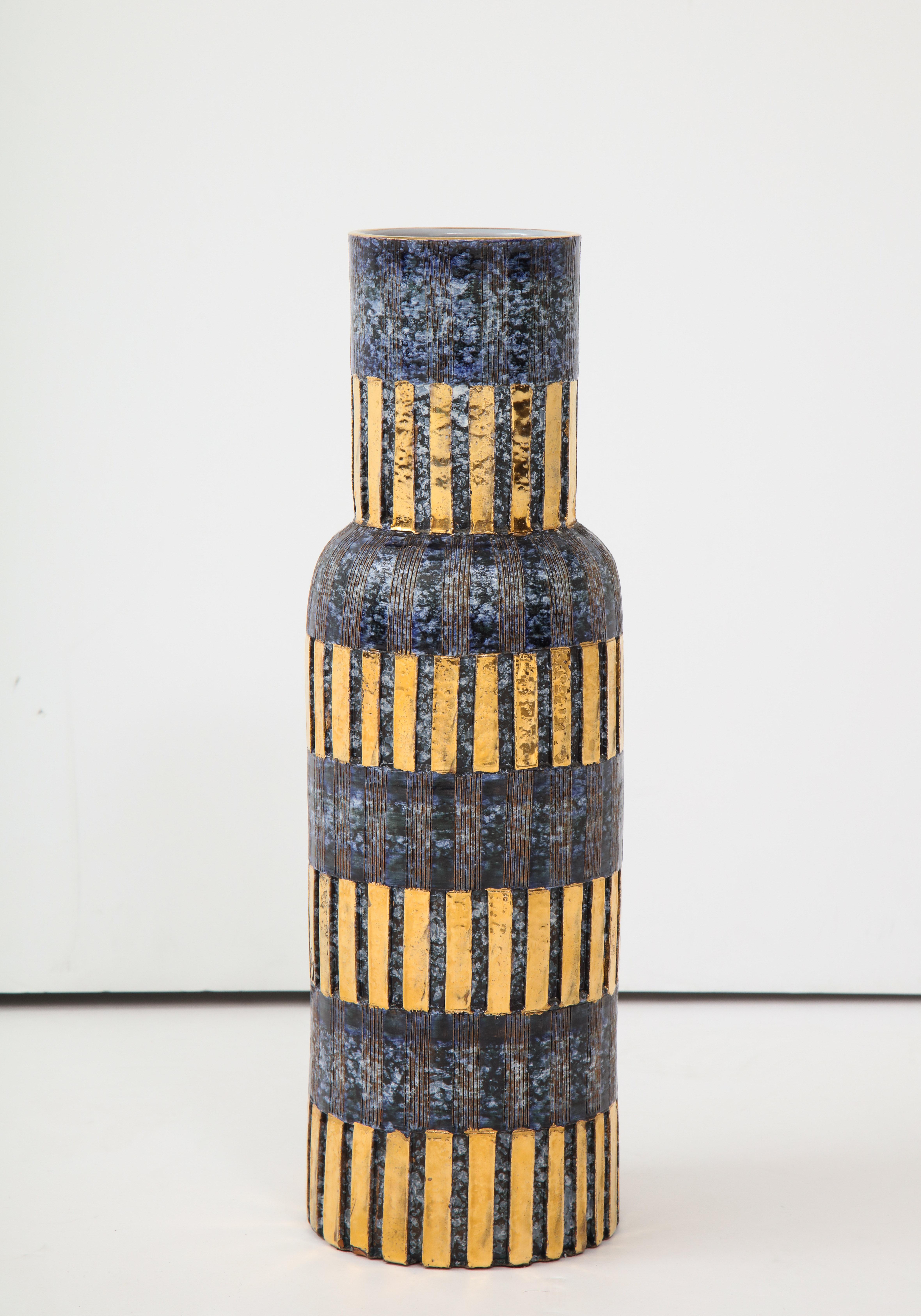 Midcentury classic bouquet vase in mottled blue glaze and 24-karat gold bands.
Stamped on bottom.