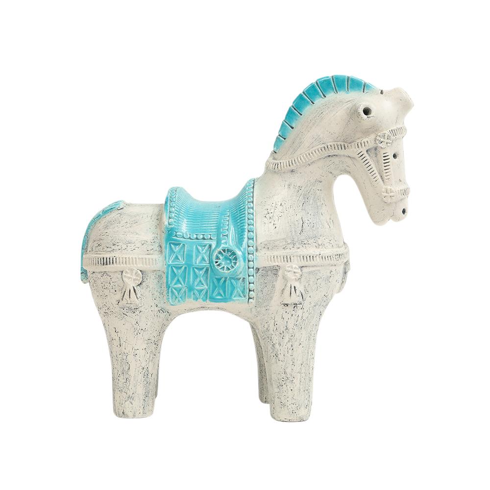Aldo Londi Bitossi Horse, Ceramic, Blue, White. A hard to find small scale horse glazed in a radiant sky blue over brushed matte white. Aldo Londi designed the saddled horse in a variety of sizes and colors for Bitossi.