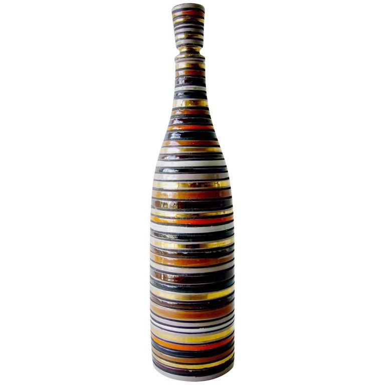 Vintage Italian modernist horizontal striped ceramic decanter with stopper designed by Aldo Londi for Bitossi of Italy. Handsome coloration and decoration on this decanter of orange, gold, off white and shades of brown, entitled Thailand Décor.