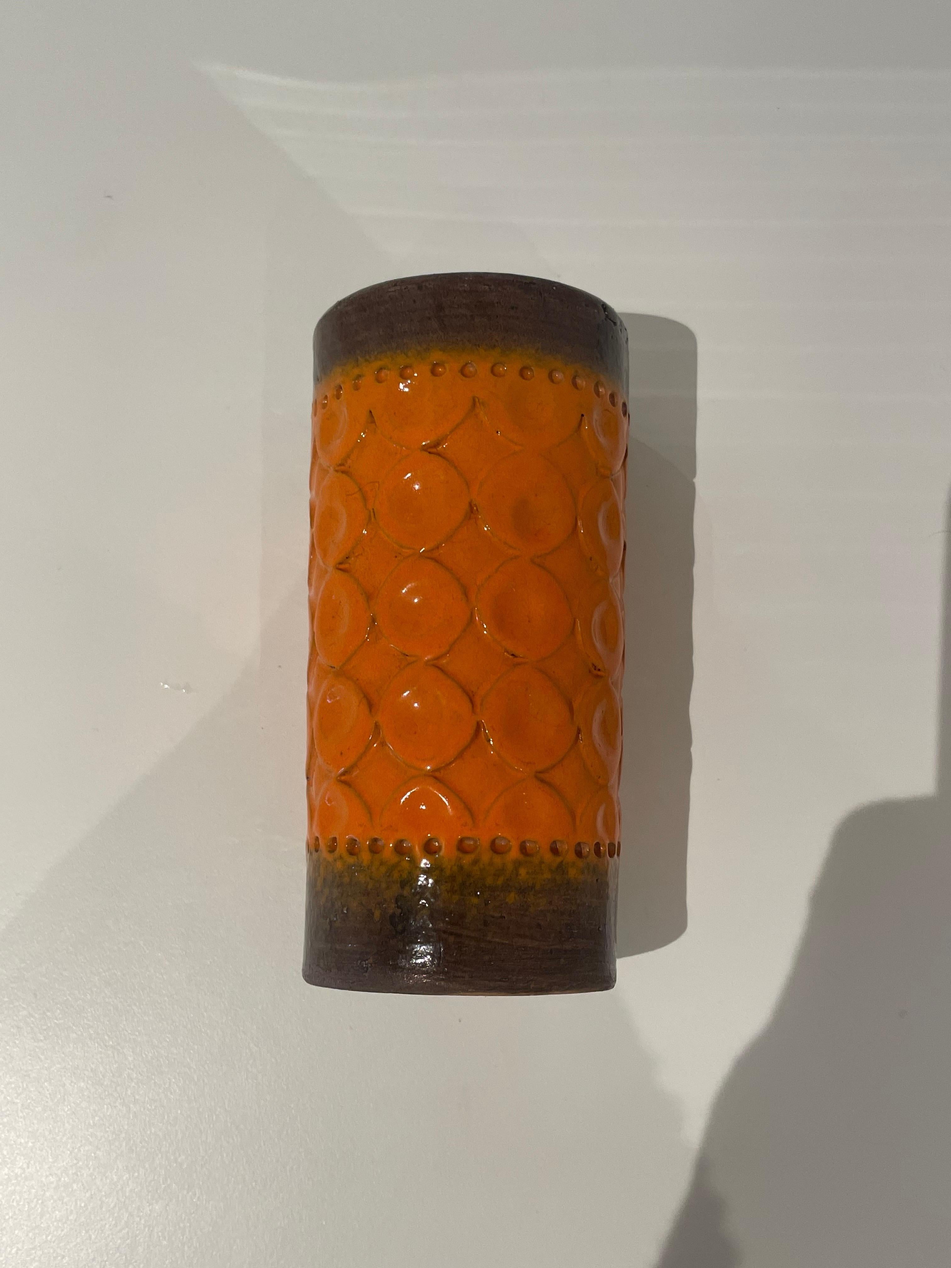 Ceramic cylinder vase with coarse brown clay neck and base and an orange glazed body decorated with rows of Aldo Londi’s circular “Torcello” motif. Bitossi, Italy
