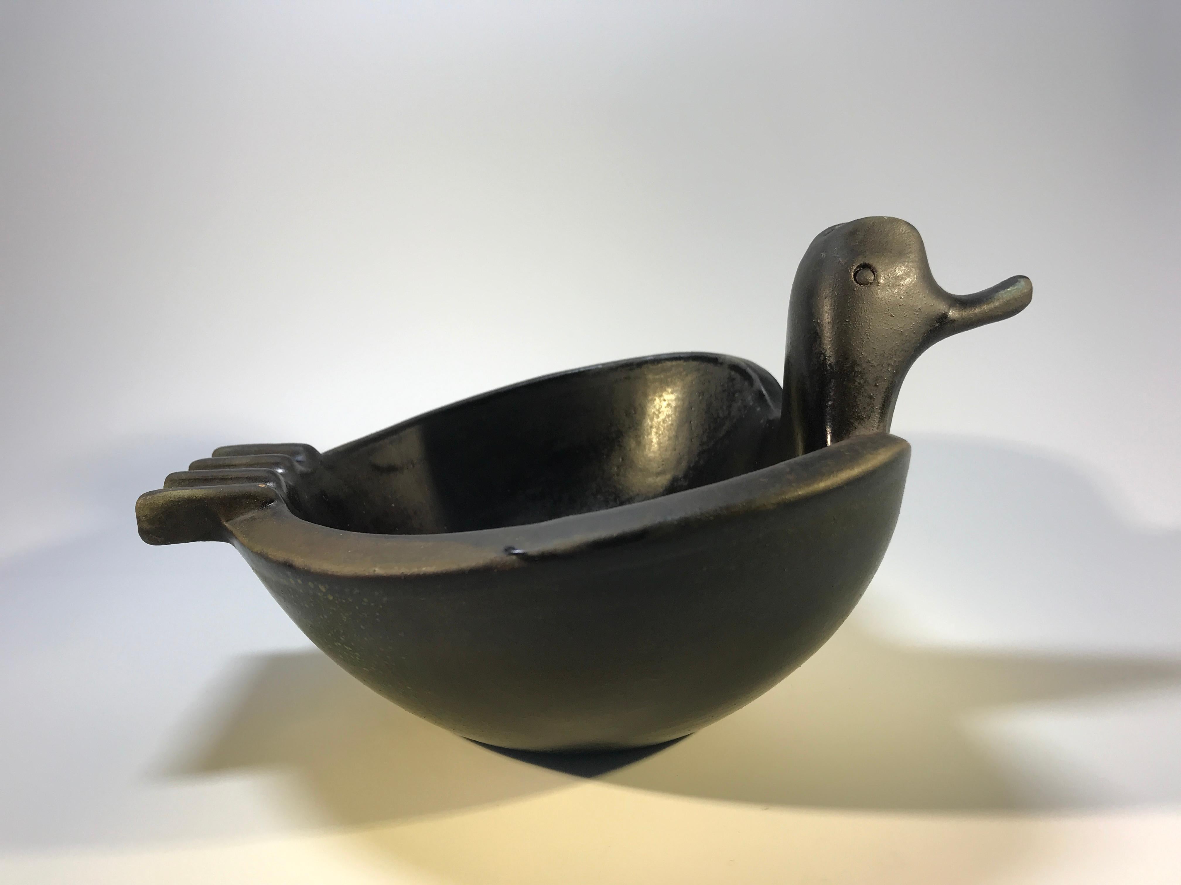 Designed by Aldo Londi for Bitossi, Italy, duck shaped bowl ashtray. Dark charcoal colored glaze with matte finish.
A quirky piece full of character from Italy,
circa 1960s
Signed and numbered 1015
In very good condition, tiny fleabite to